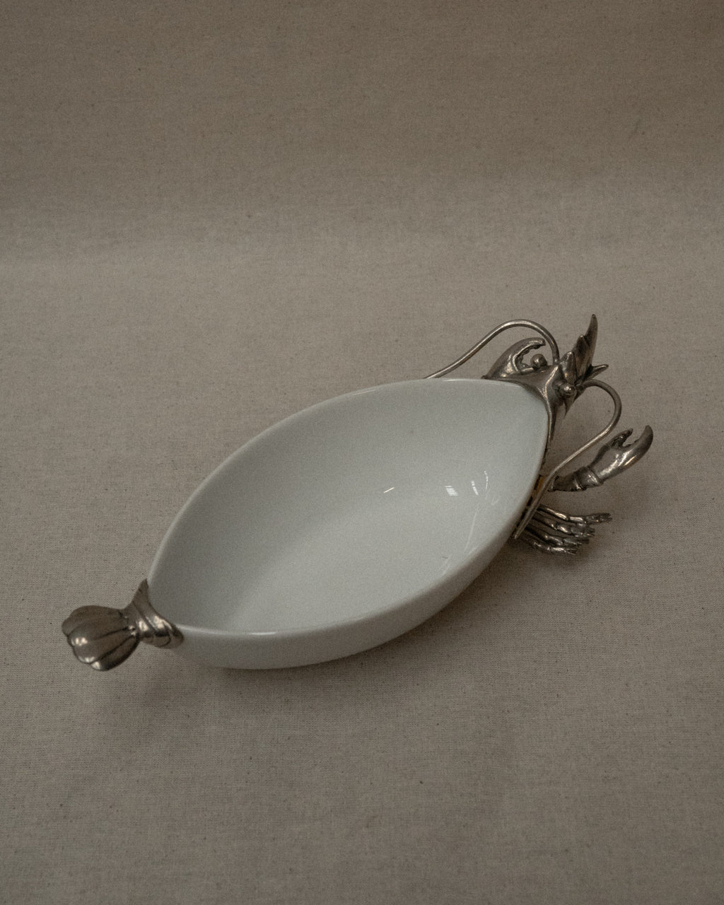 White ceramic dish with silver coloured lobster