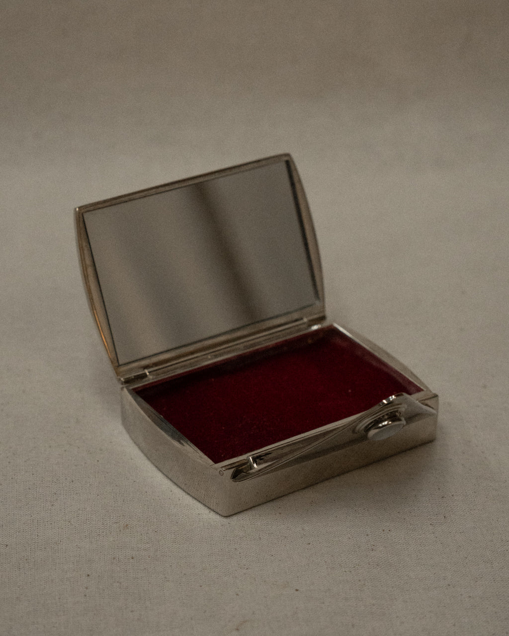 Chrome letter shaped compact case with mirror