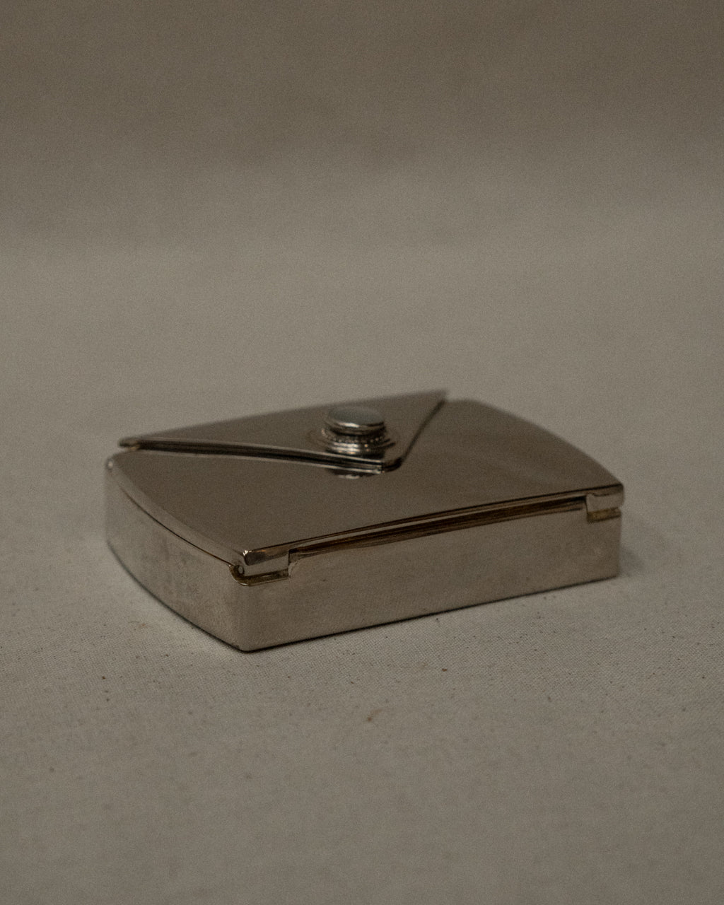 Chrome letter shaped compact case with mirror