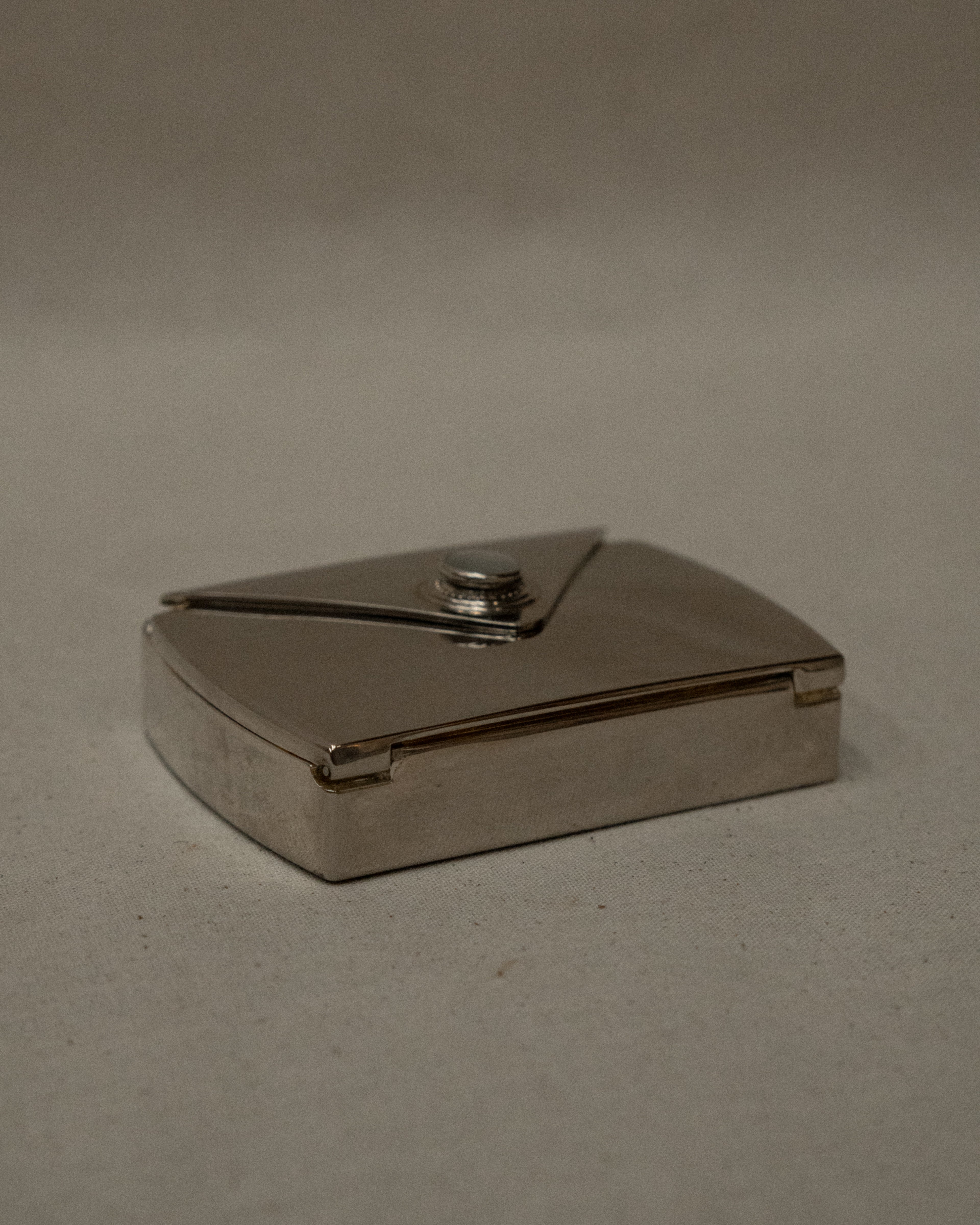 Chrome letter shaped compact case with mirror