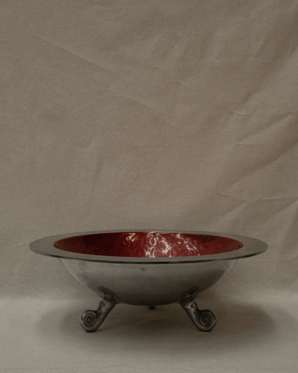 Large aluminum round bowl with spiral feet