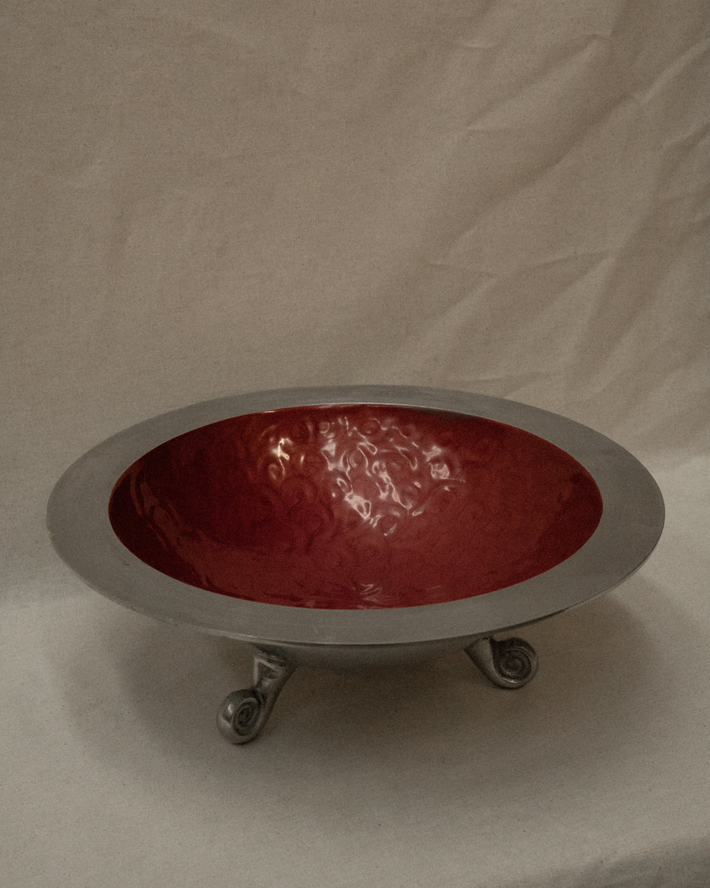 Large aluminum round bowl with spiral feet