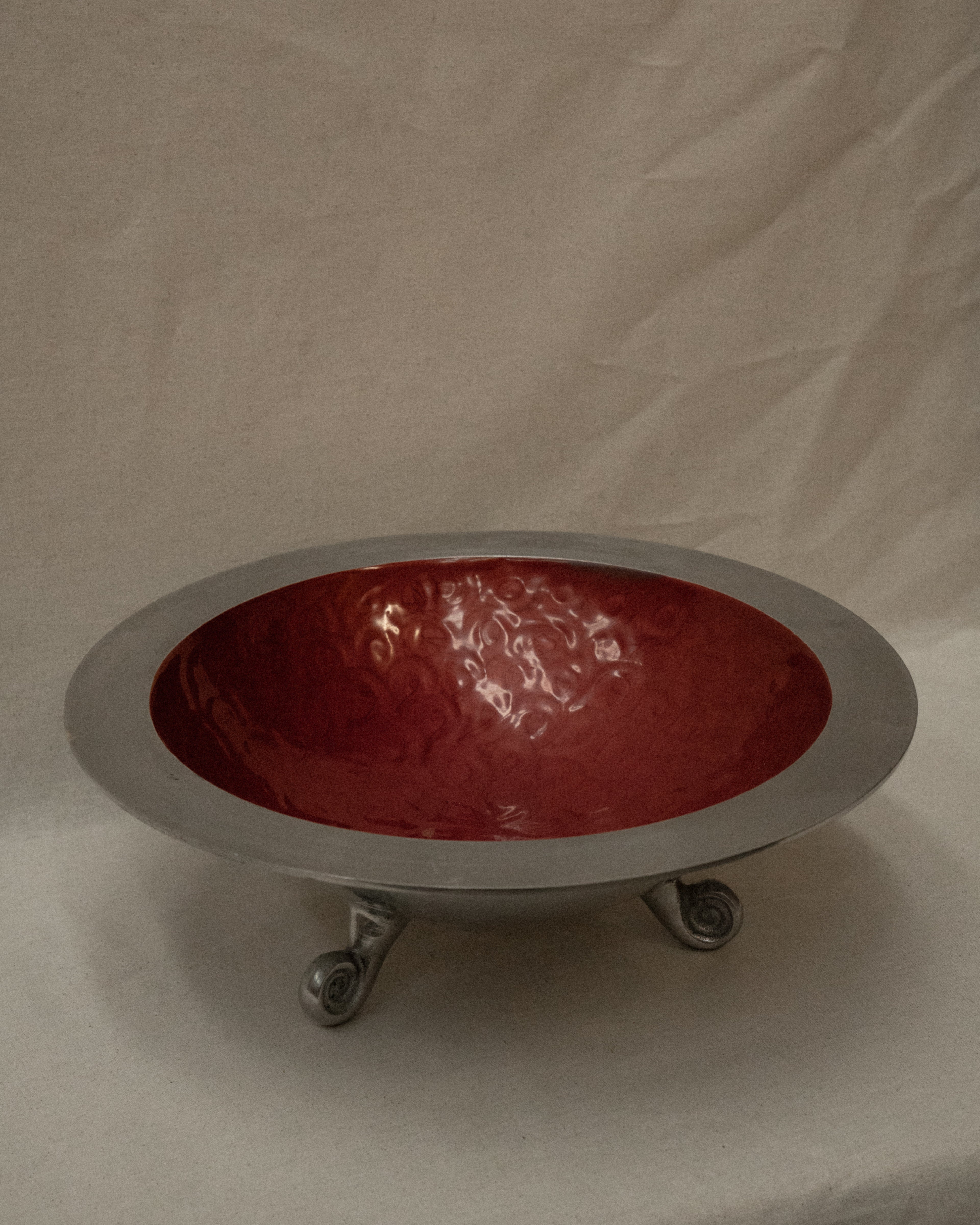 Large aluminum round bowl with spiral feet