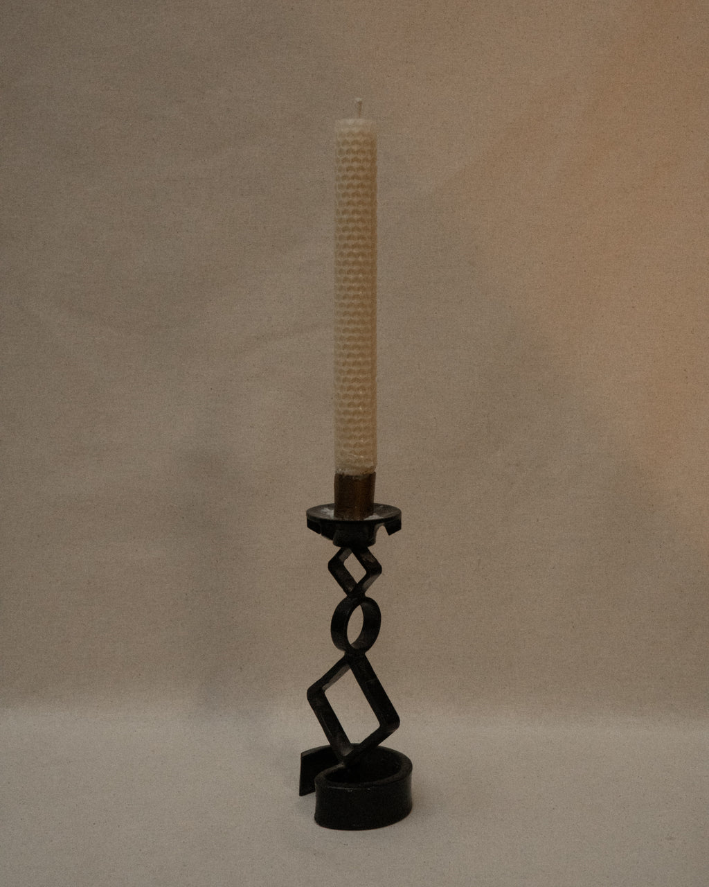 Black steel candle holder with diamond and circle shapes