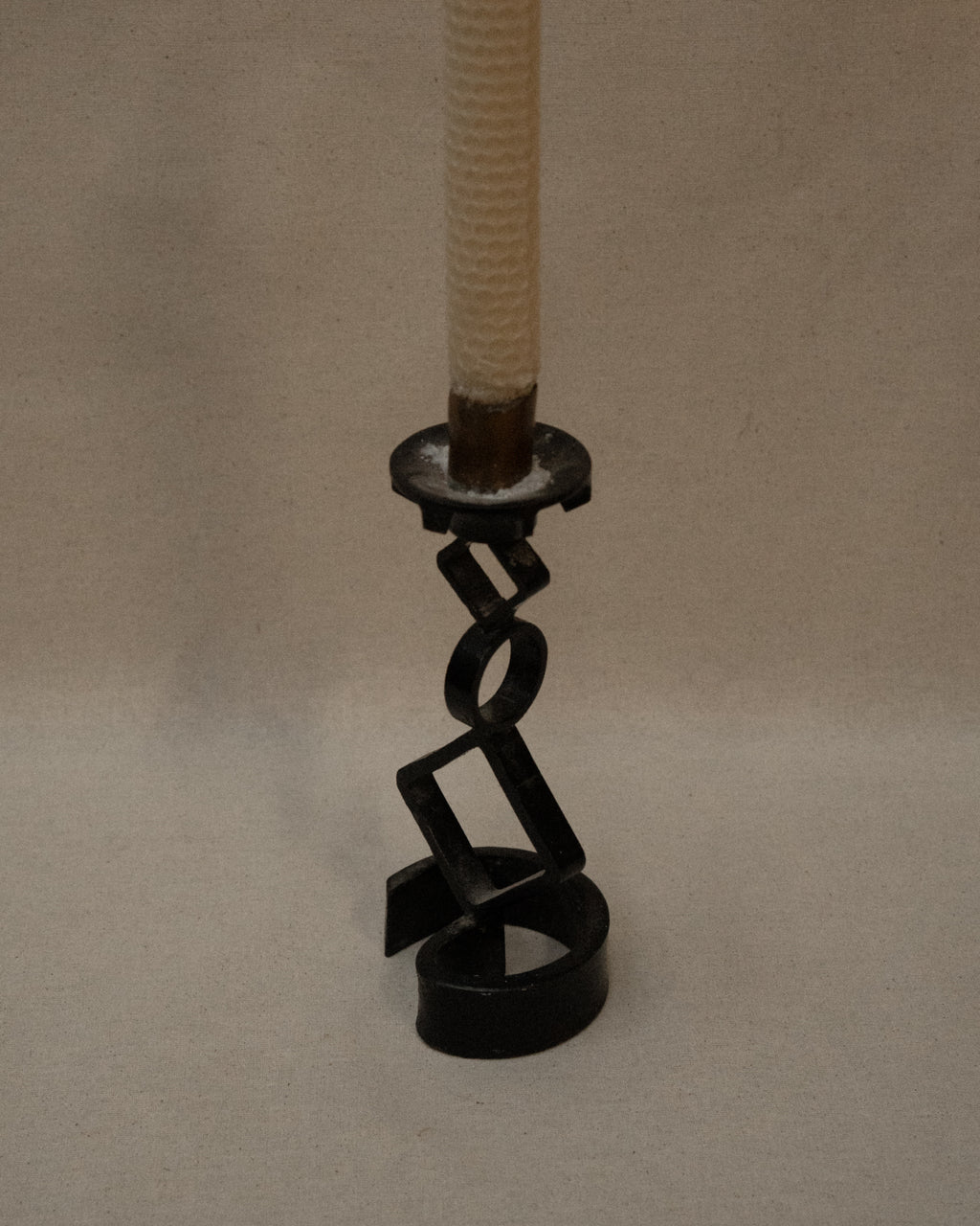 Black steel candle holder with diamond and circle shapes