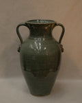 Large vase with handles and faces by Australian ceramicist Graeme Potter