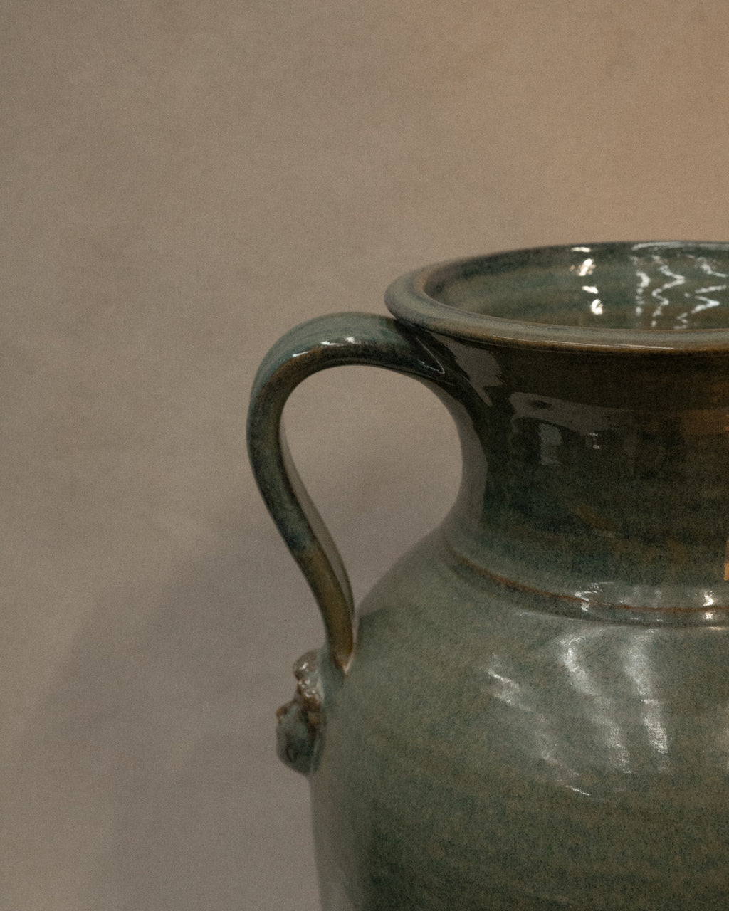 Large vase with handles and faces by Australian ceramicist Graeme Potter