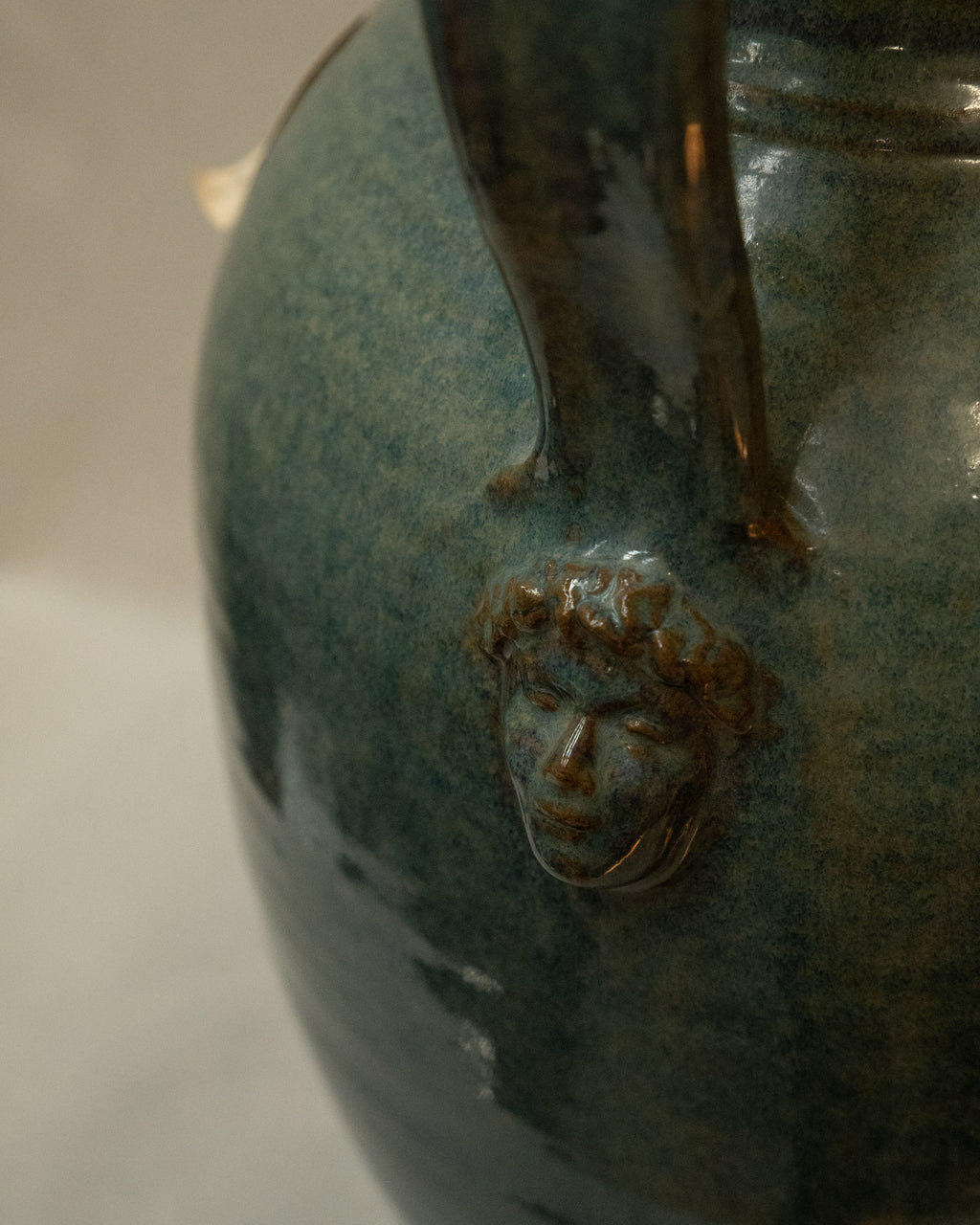 Large vase with handles and faces by Australian ceramicist Graeme Potter