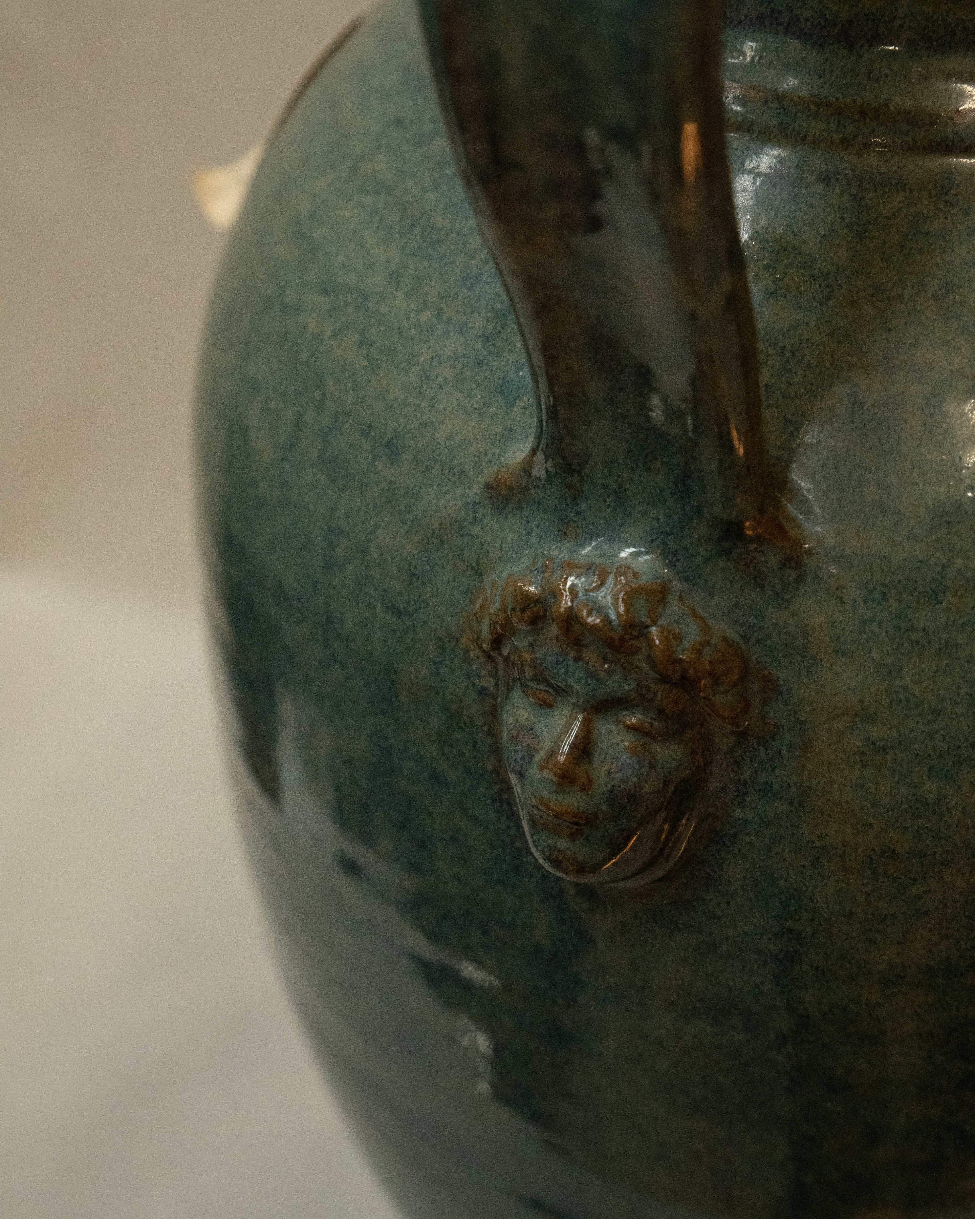 Large vase with handles and faces by Australian ceramicist Graeme Potter
