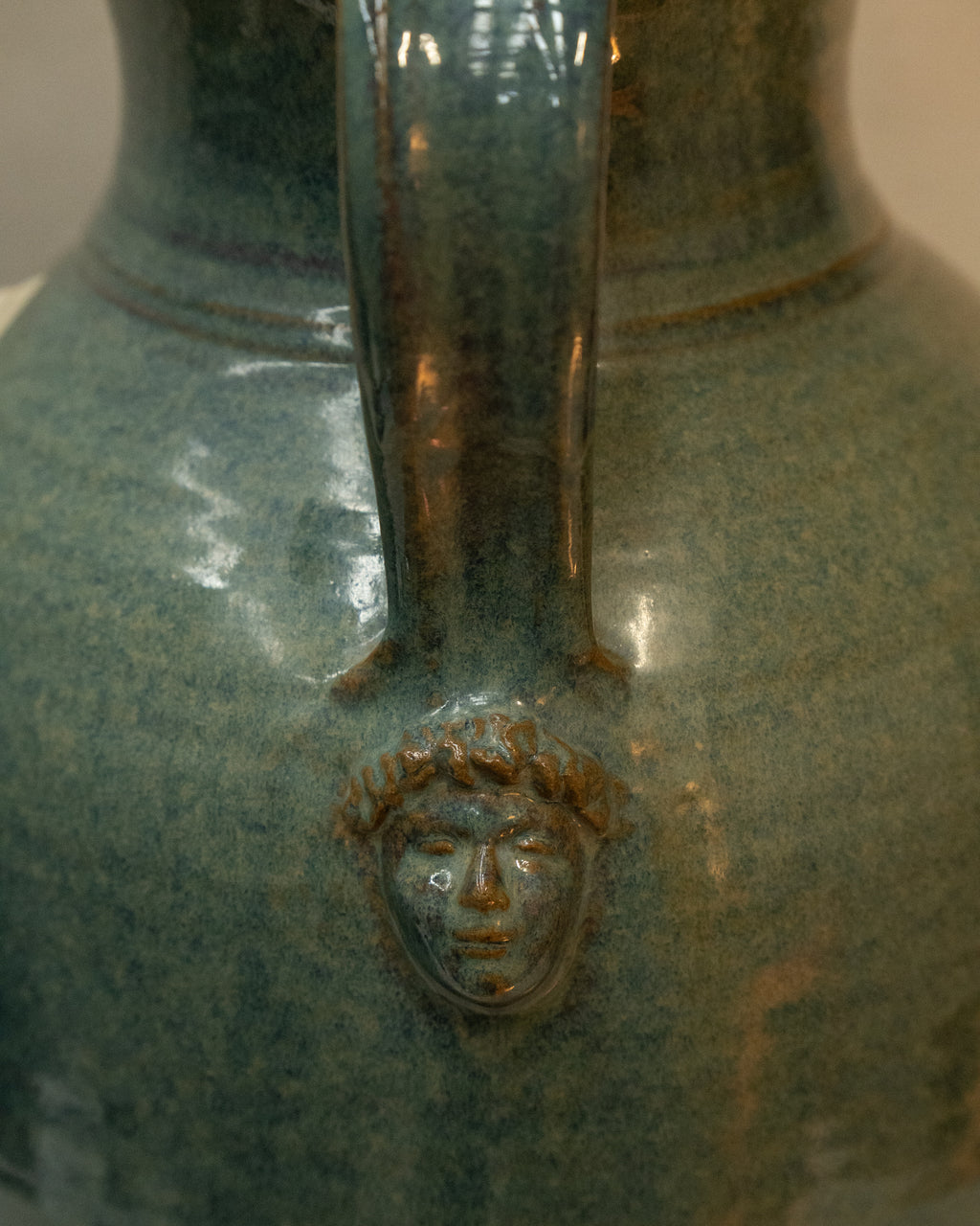 Large vase with handles and faces by Australian ceramicist Graeme Potter
