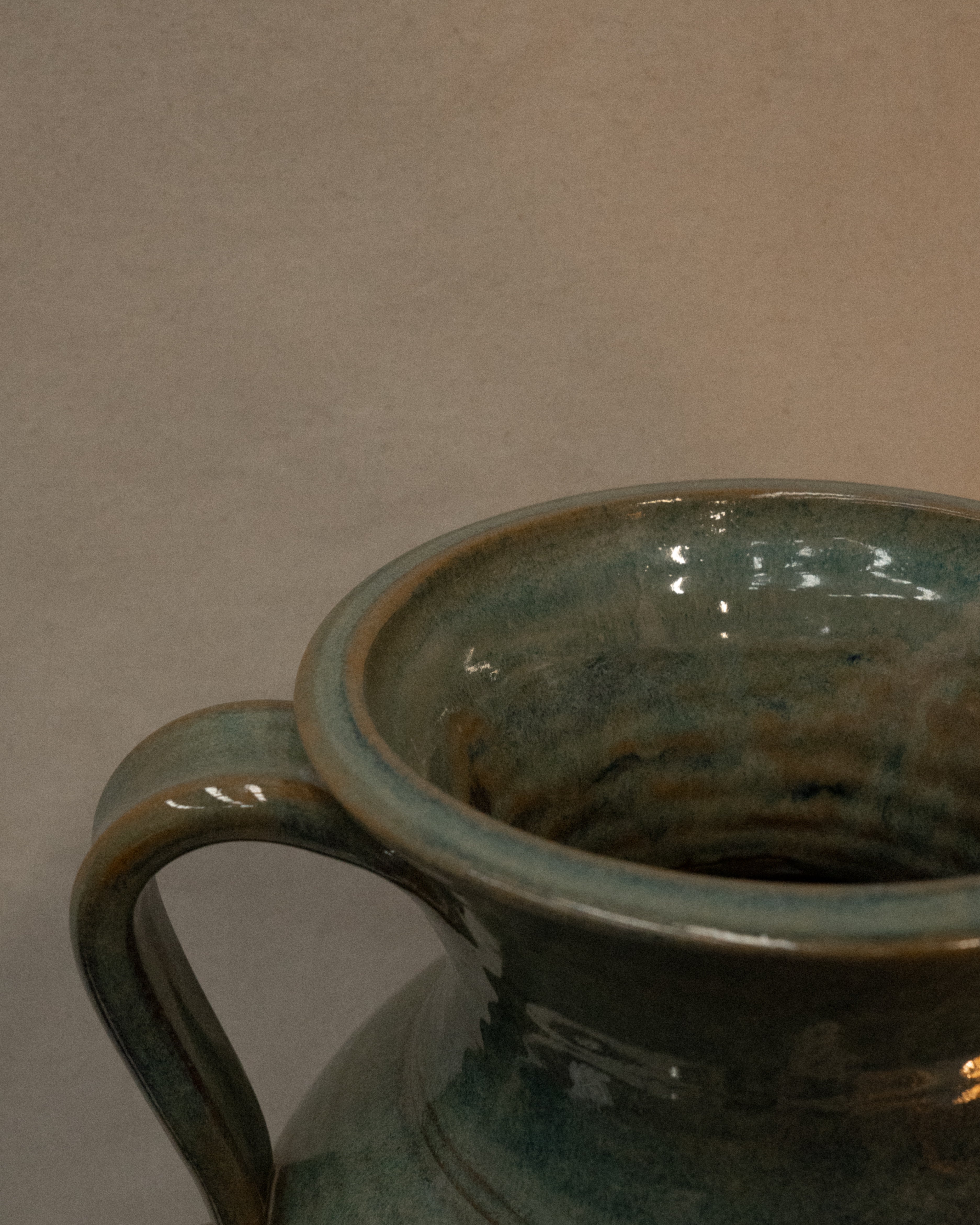 Large vase with handles and faces by Australian ceramicist Graeme Potter