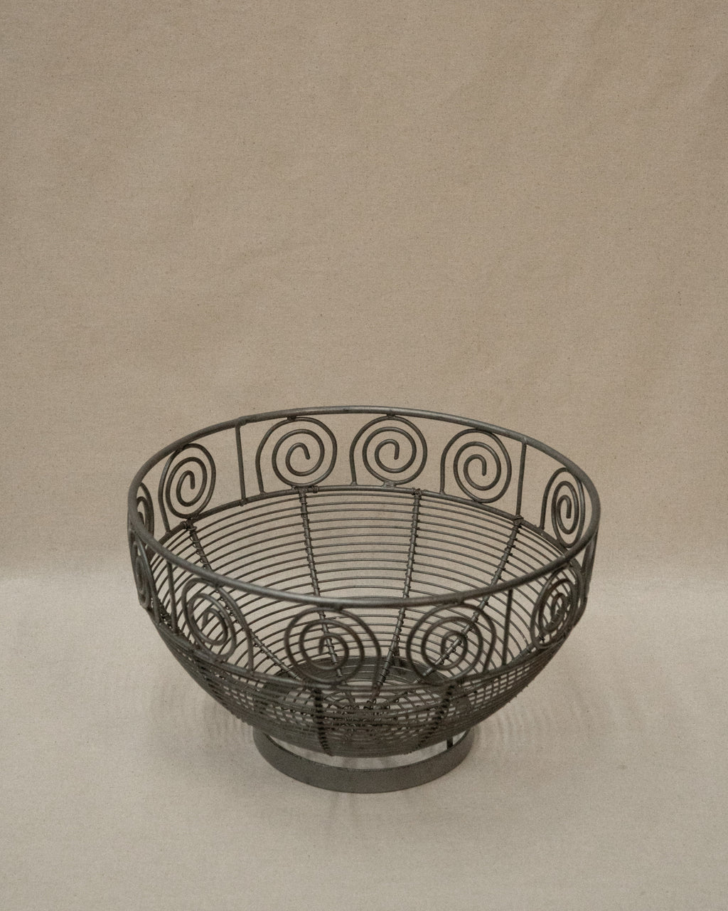 Wrought metal fruit bowl with spirals