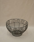 Wrought metal fruit bowl with spirals