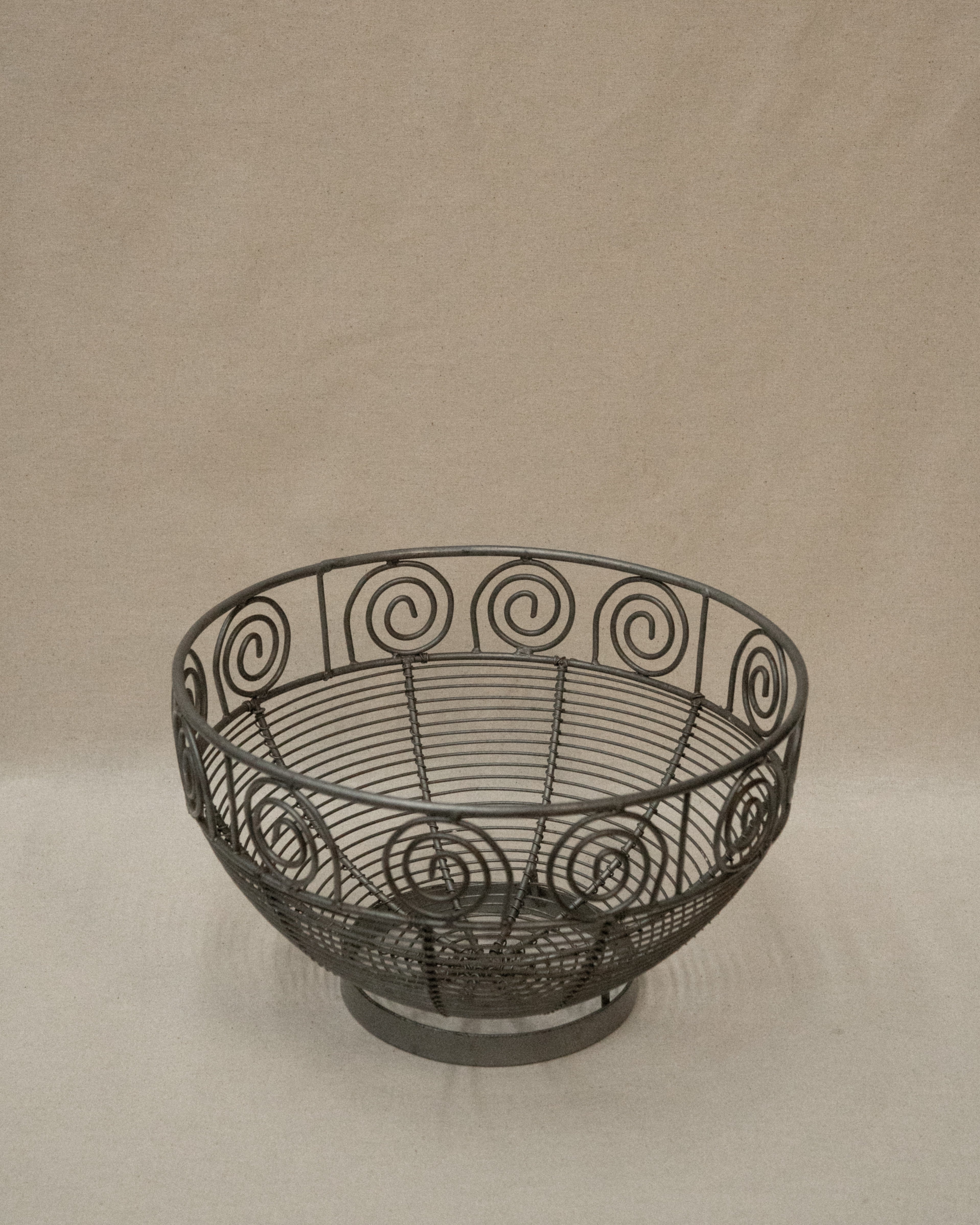 Wrought metal fruit bowl with spirals