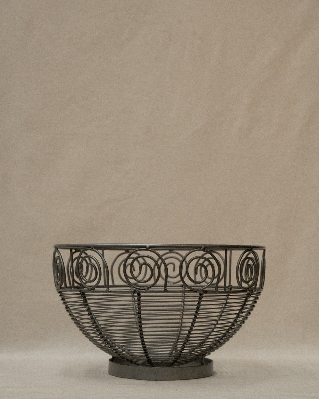 Wrought metal fruit bowl with spirals