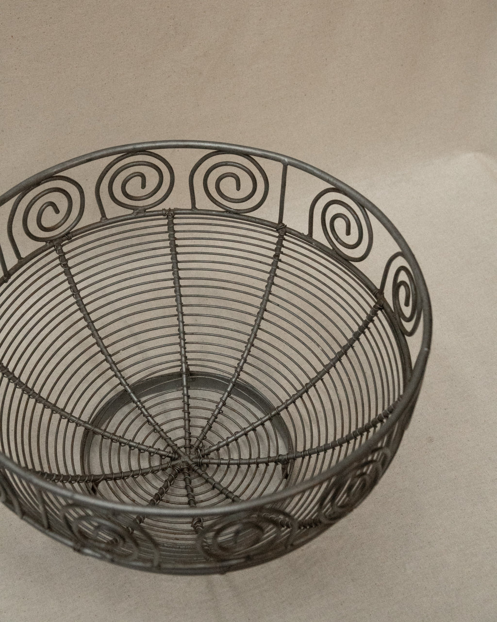 Wrought metal fruit bowl with spirals