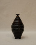 Dark wooden turned container with lid