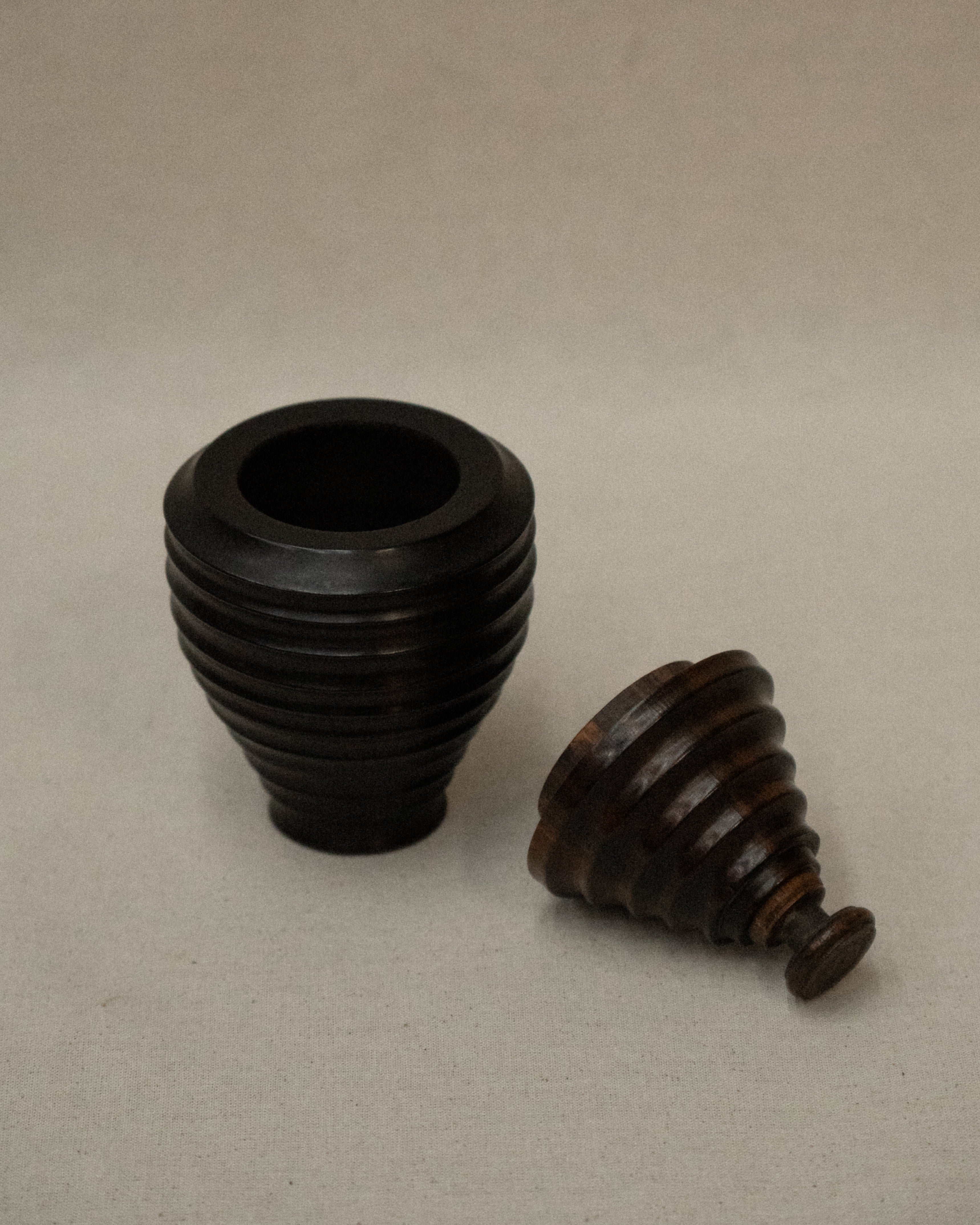 Dark wooden turned container with lid