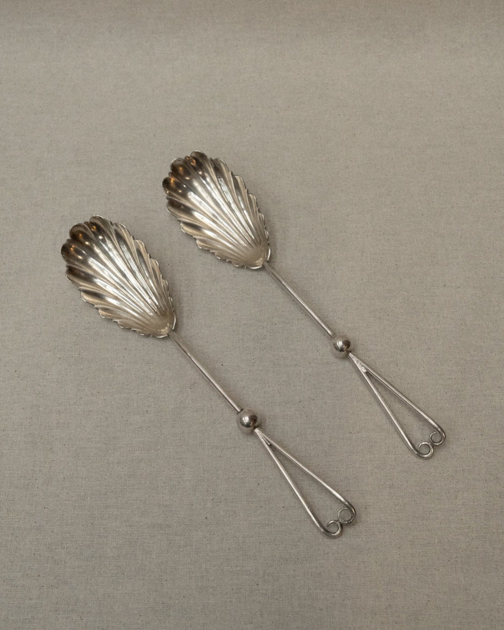 Silver plated shell servers with spiral heart handles