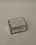 Mirrorred trinket box with etchings, rope edges, scroll handle and lined with fabric