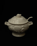 White ceramic punch bowl adorned with shells