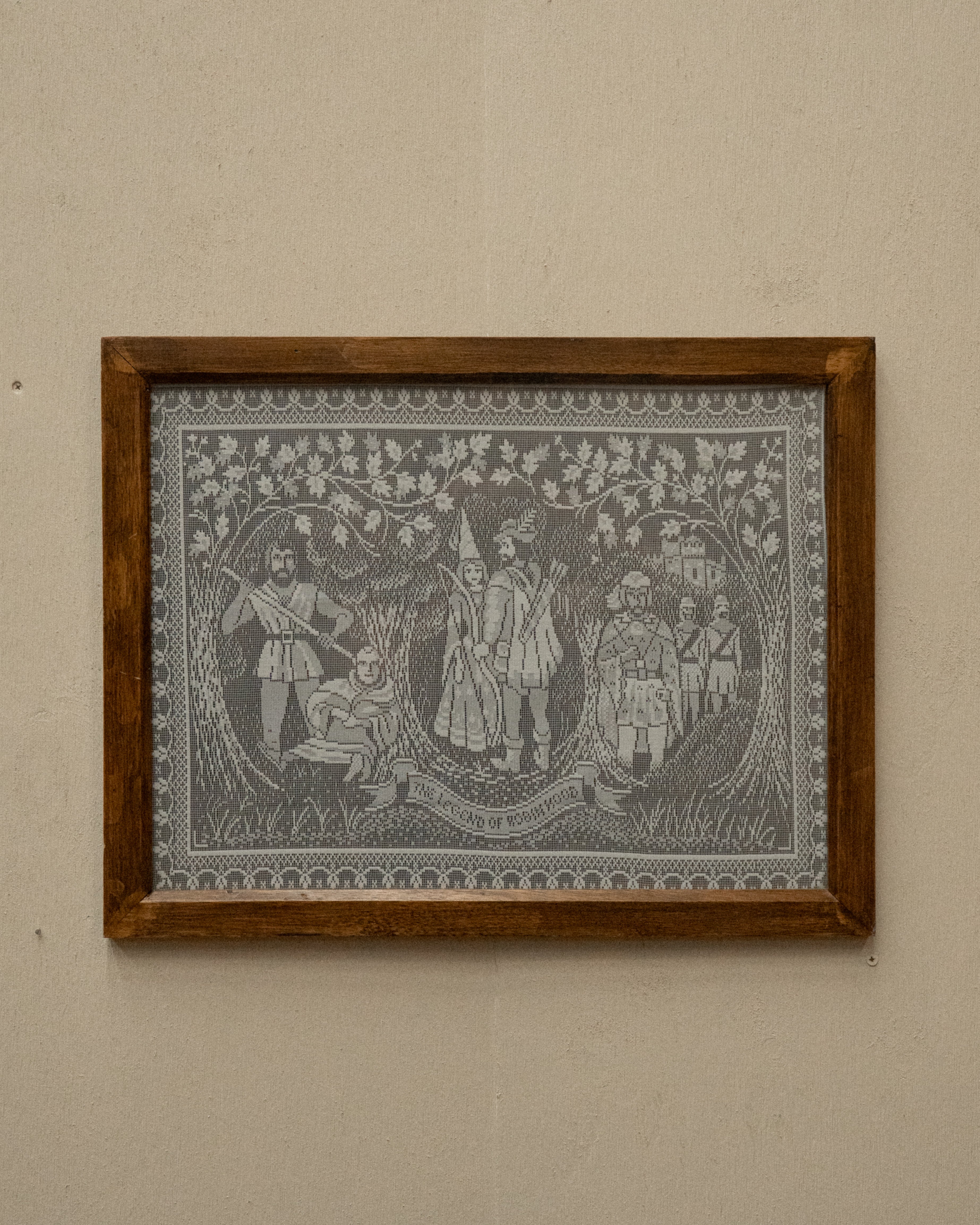 Crochet artwork of Robinhood in wooden frame