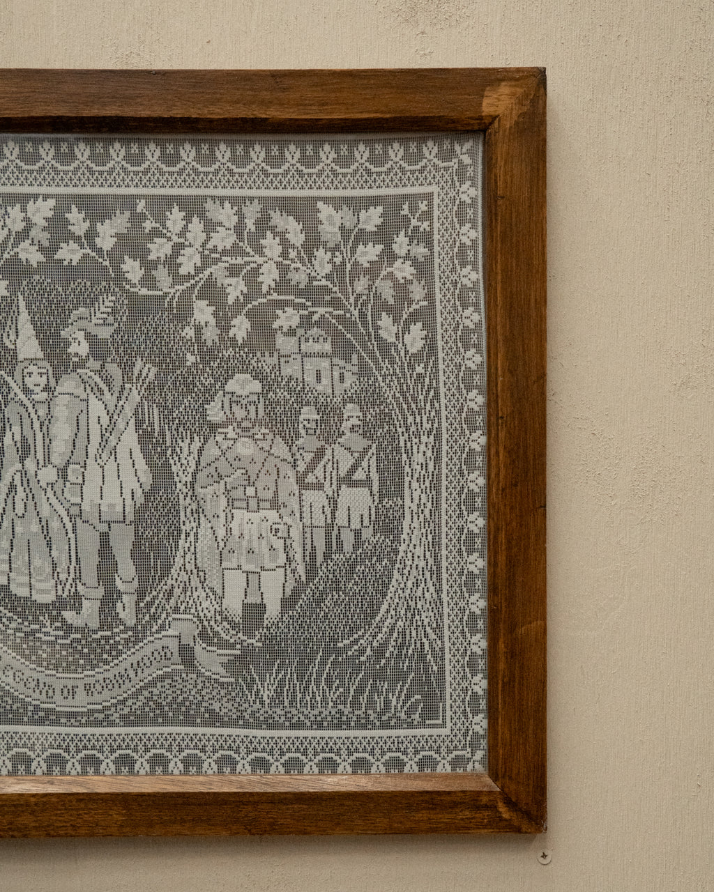Crochet artwork of Robinhood in wooden frame