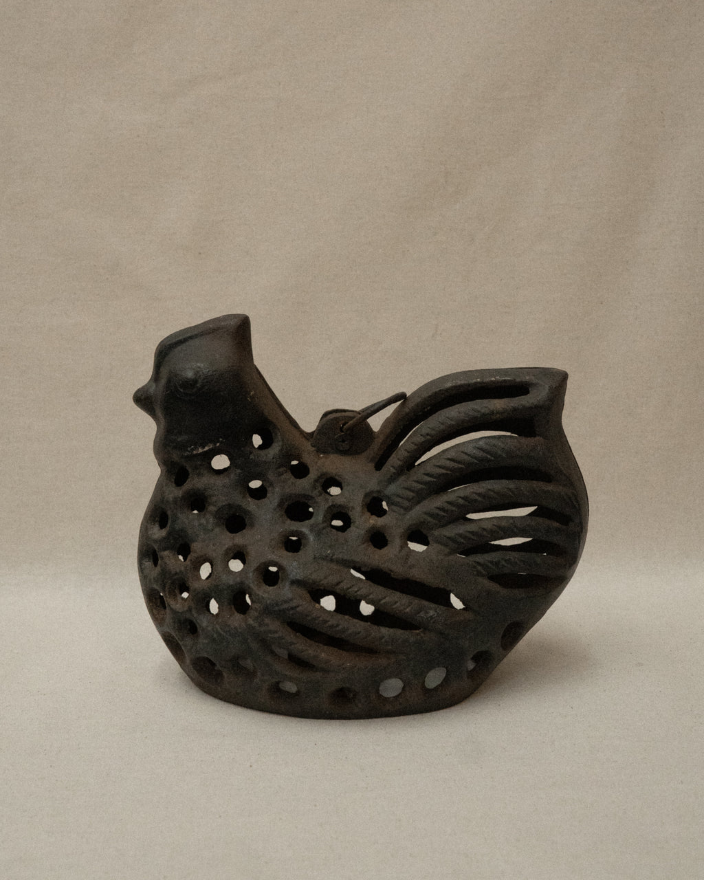 Cast iron hen with a tealight candle holder and ring