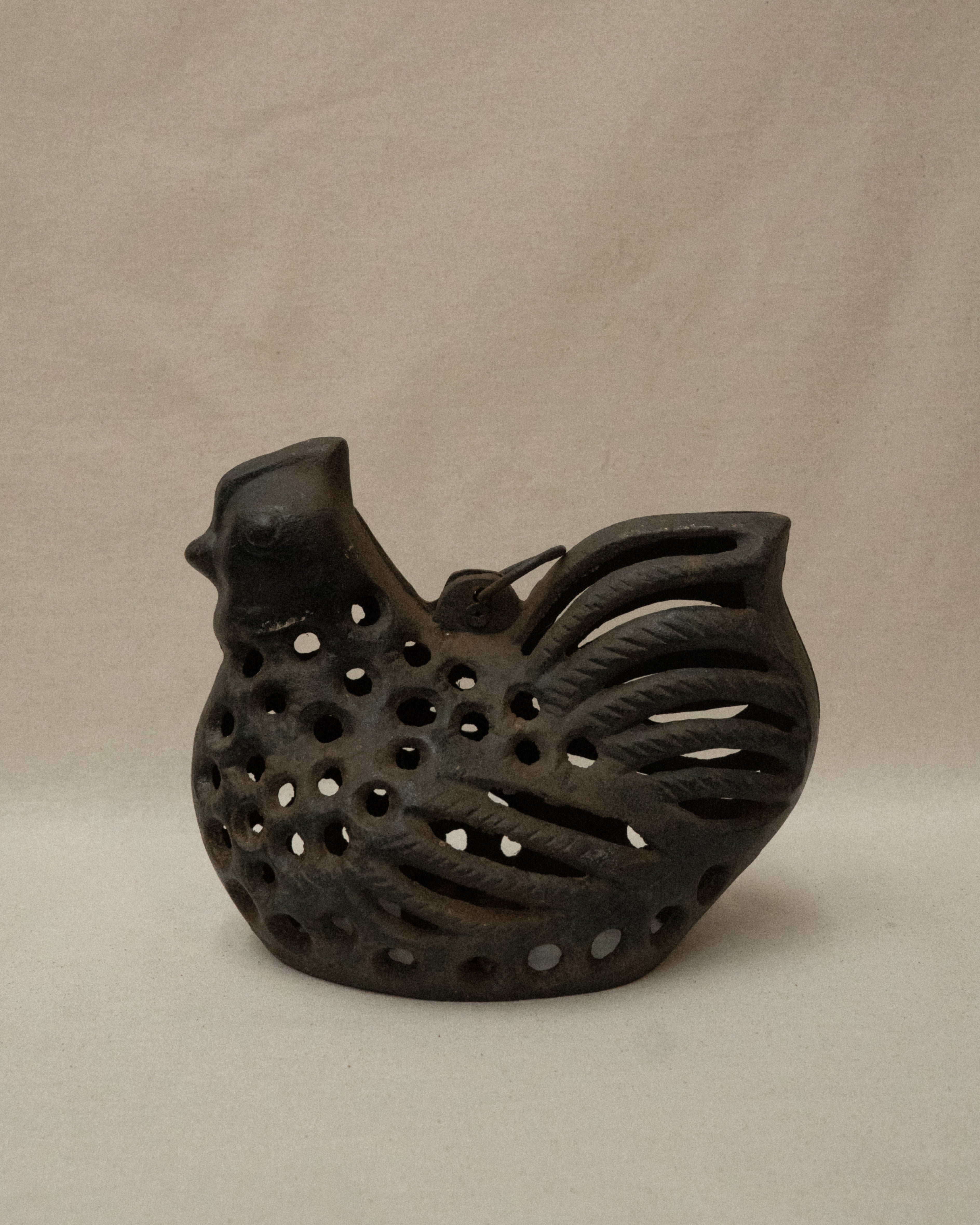Cast iron hen with a tealight candle holder and ring