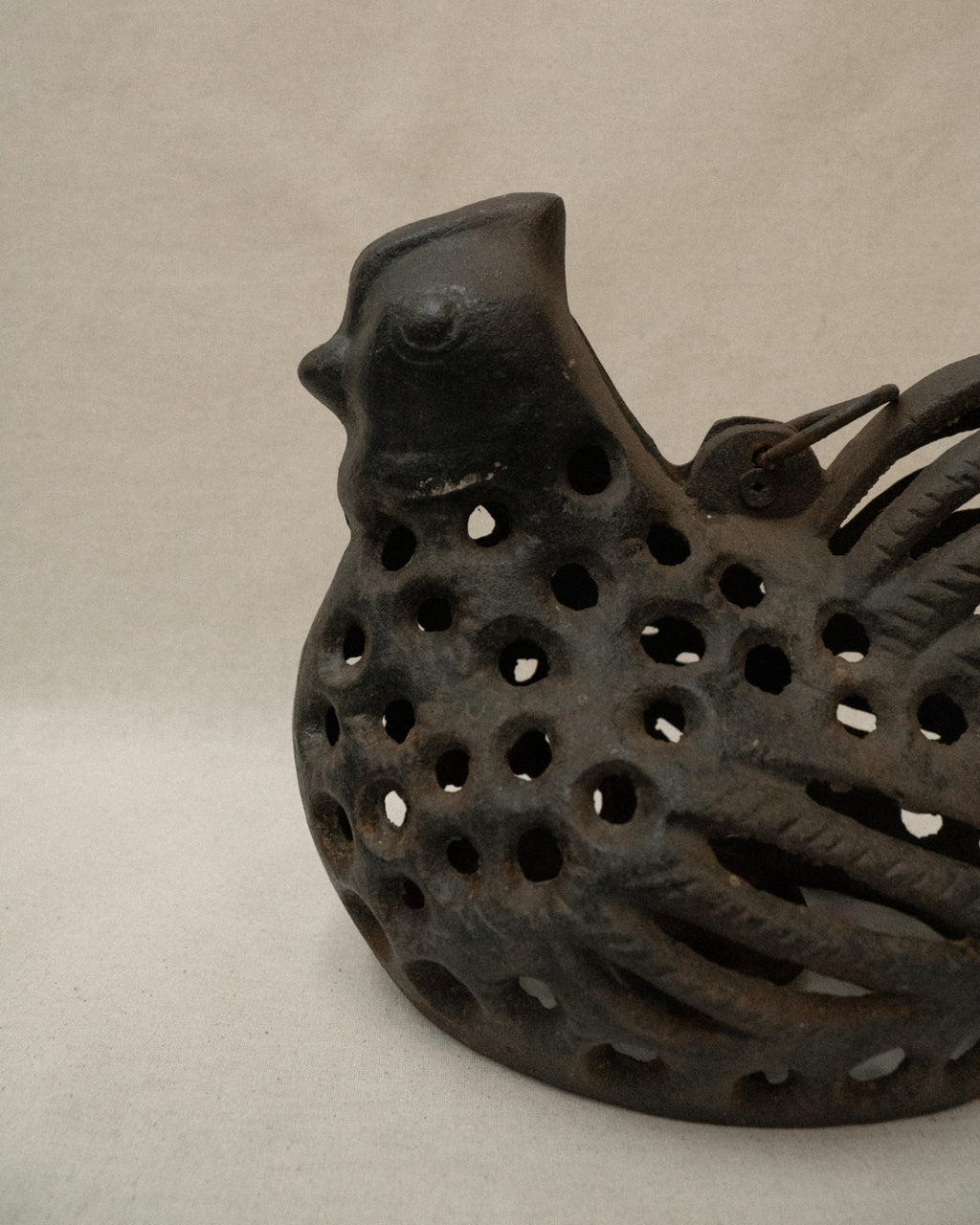 Cast iron hen with a tealight candle holder and ring