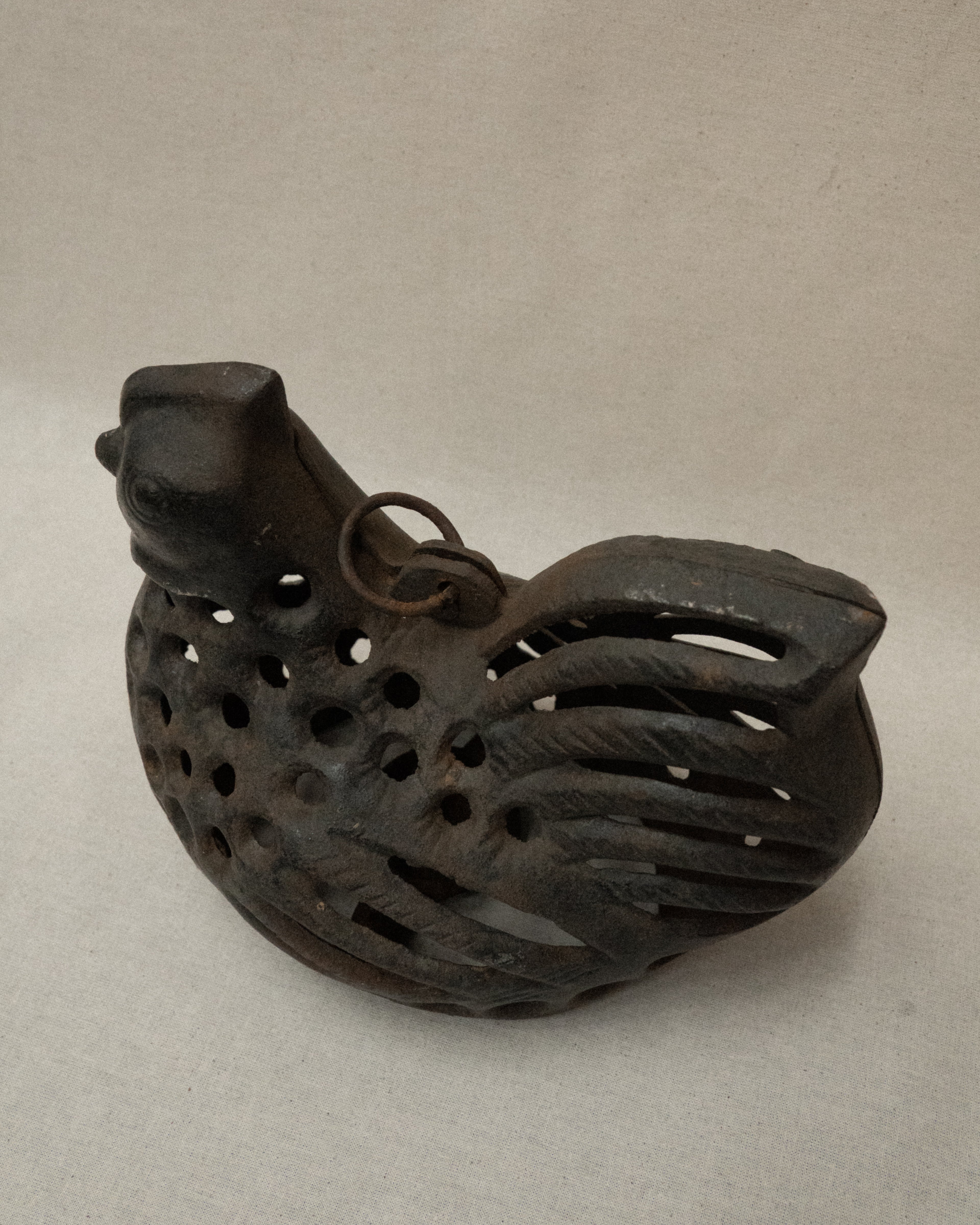 Cast iron hen with a tealight candle holder and ring