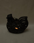 Cast iron hen with a tealight candle holder and ring
