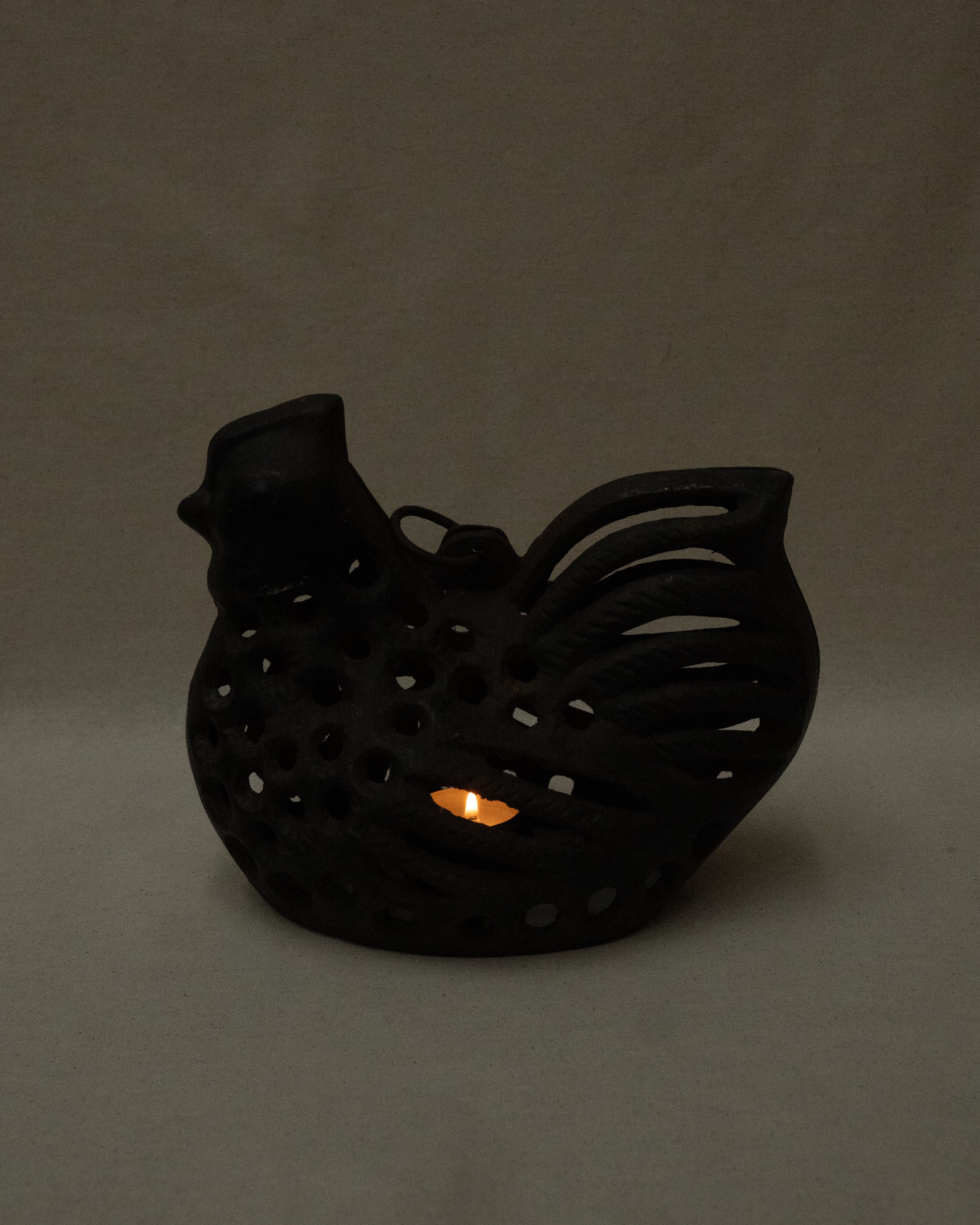 Cast iron hen with a tealight candle holder and ring