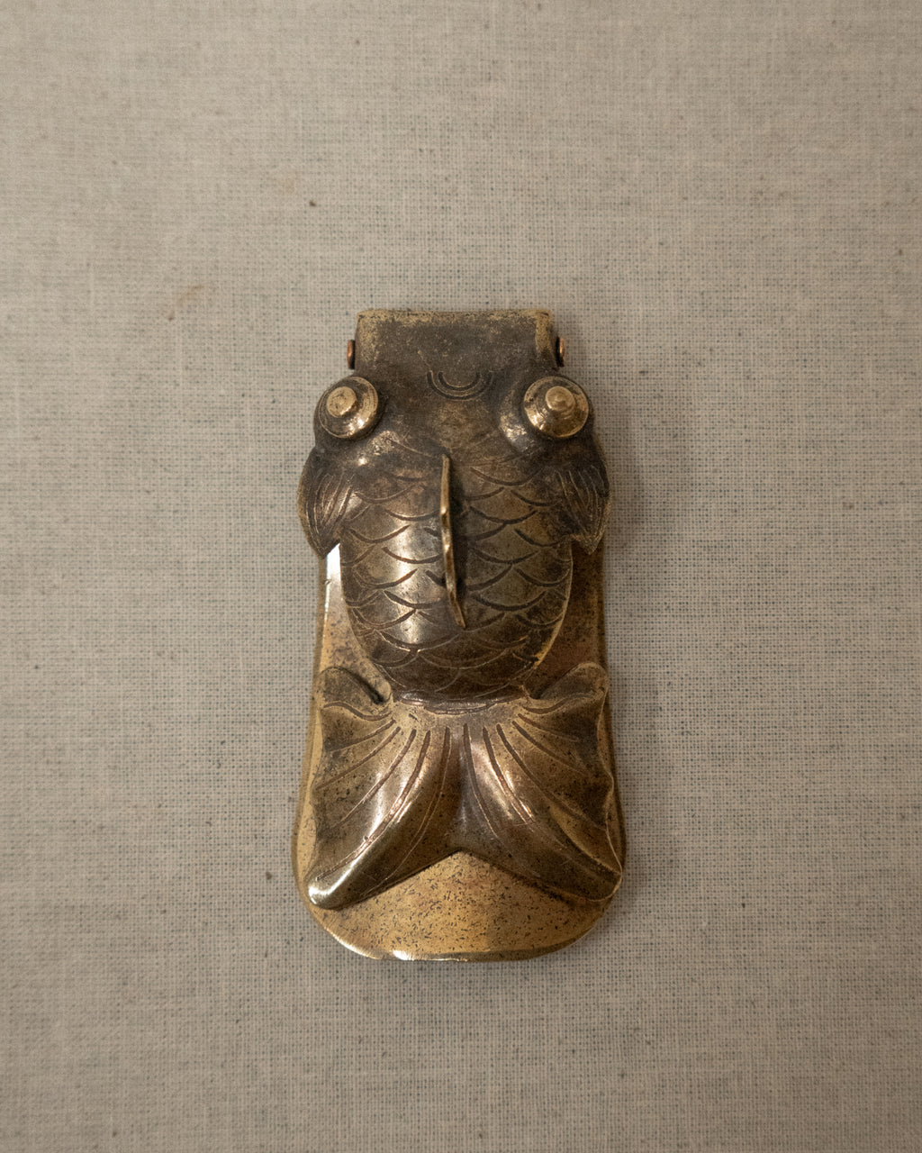 Foldable brass goldfish shoe horn
