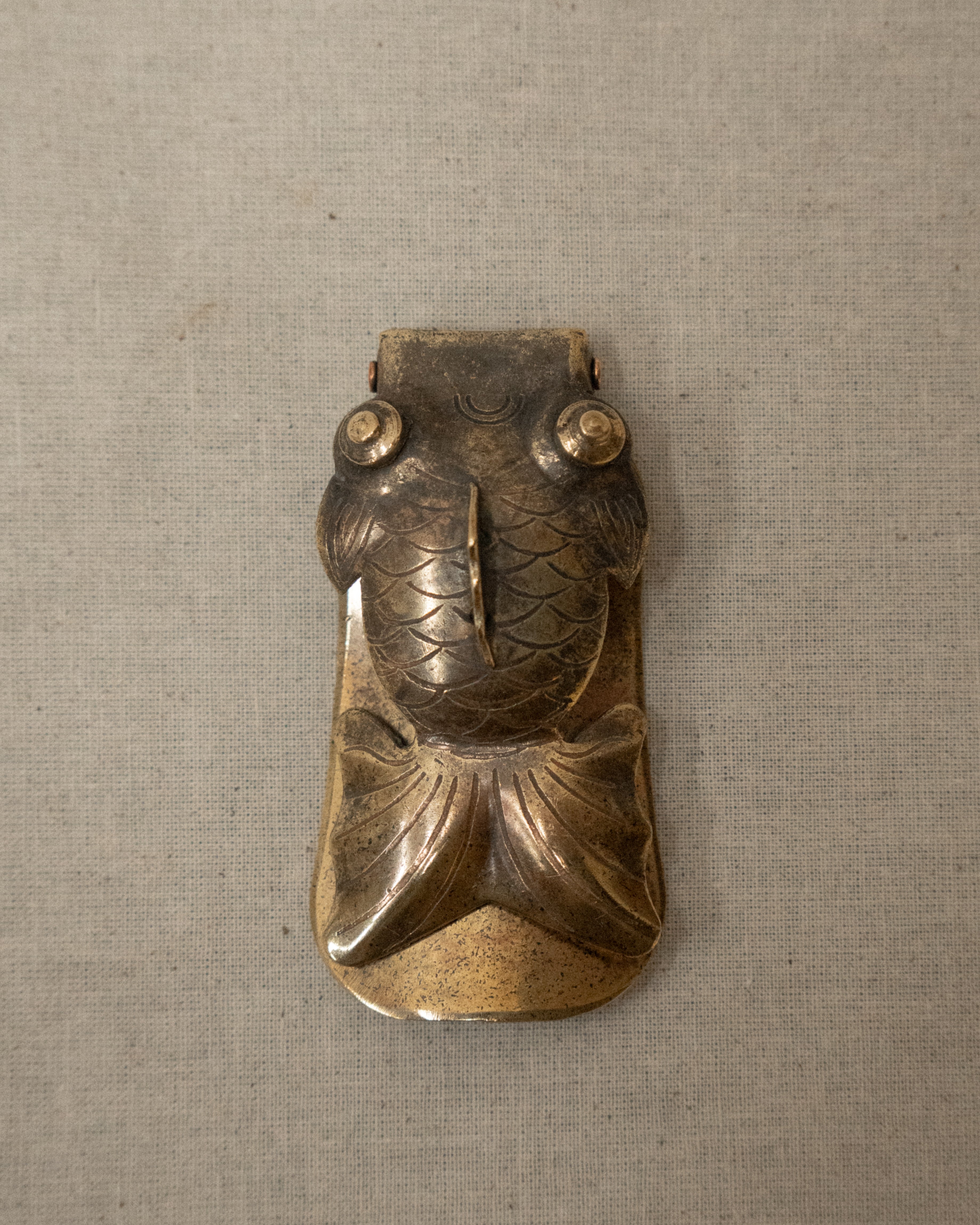 Foldable brass goldfish shoe horn