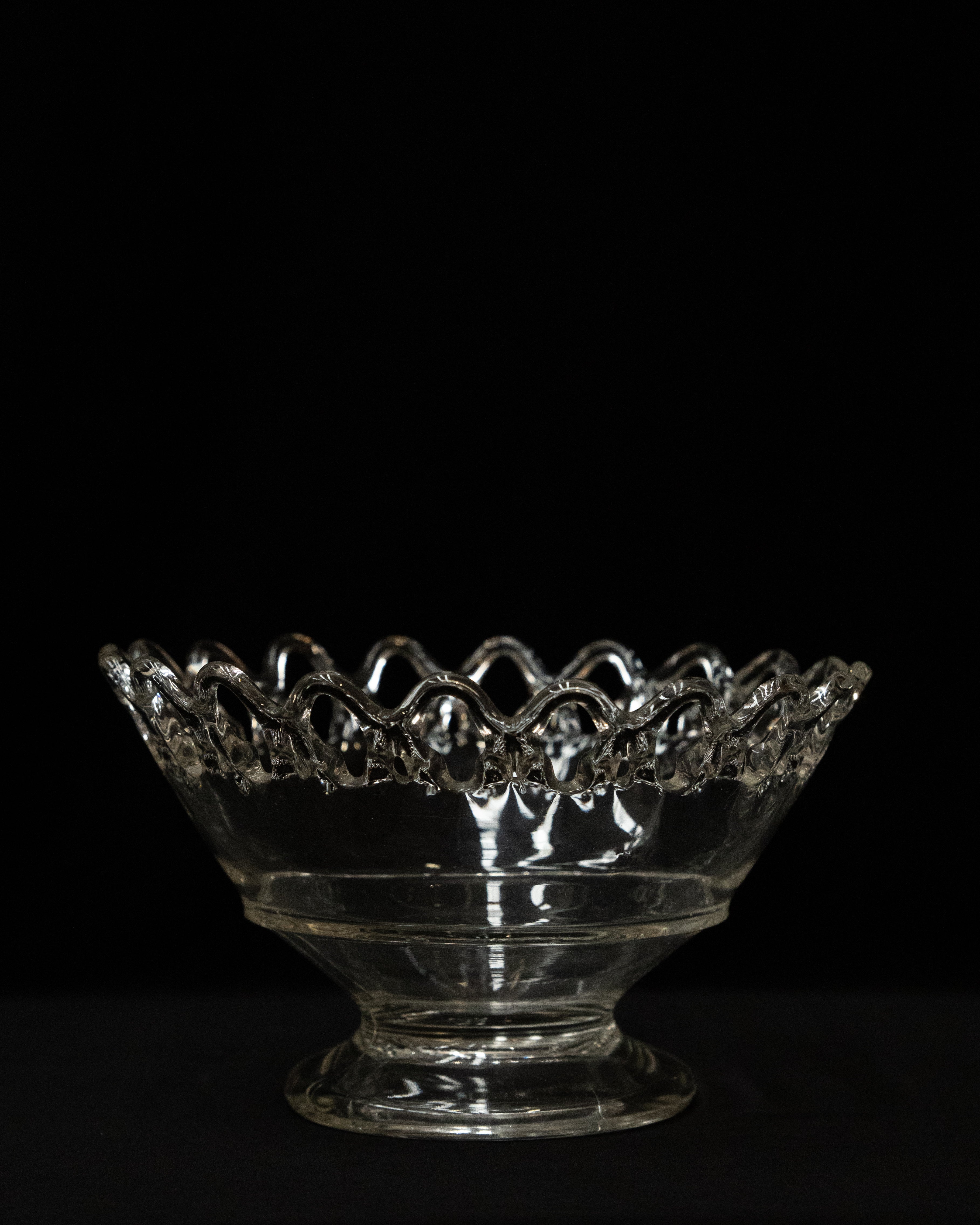 Clear art glass bowl with lace like details