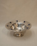 Silver plated bowl adorned with blue stones
