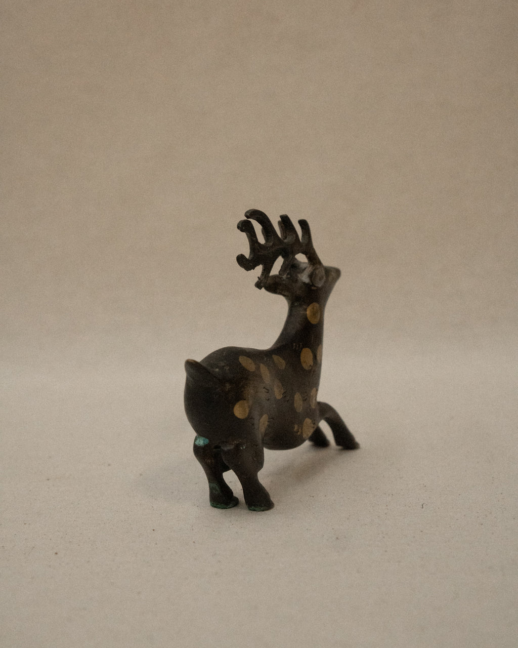 Solid spotted brass deer
