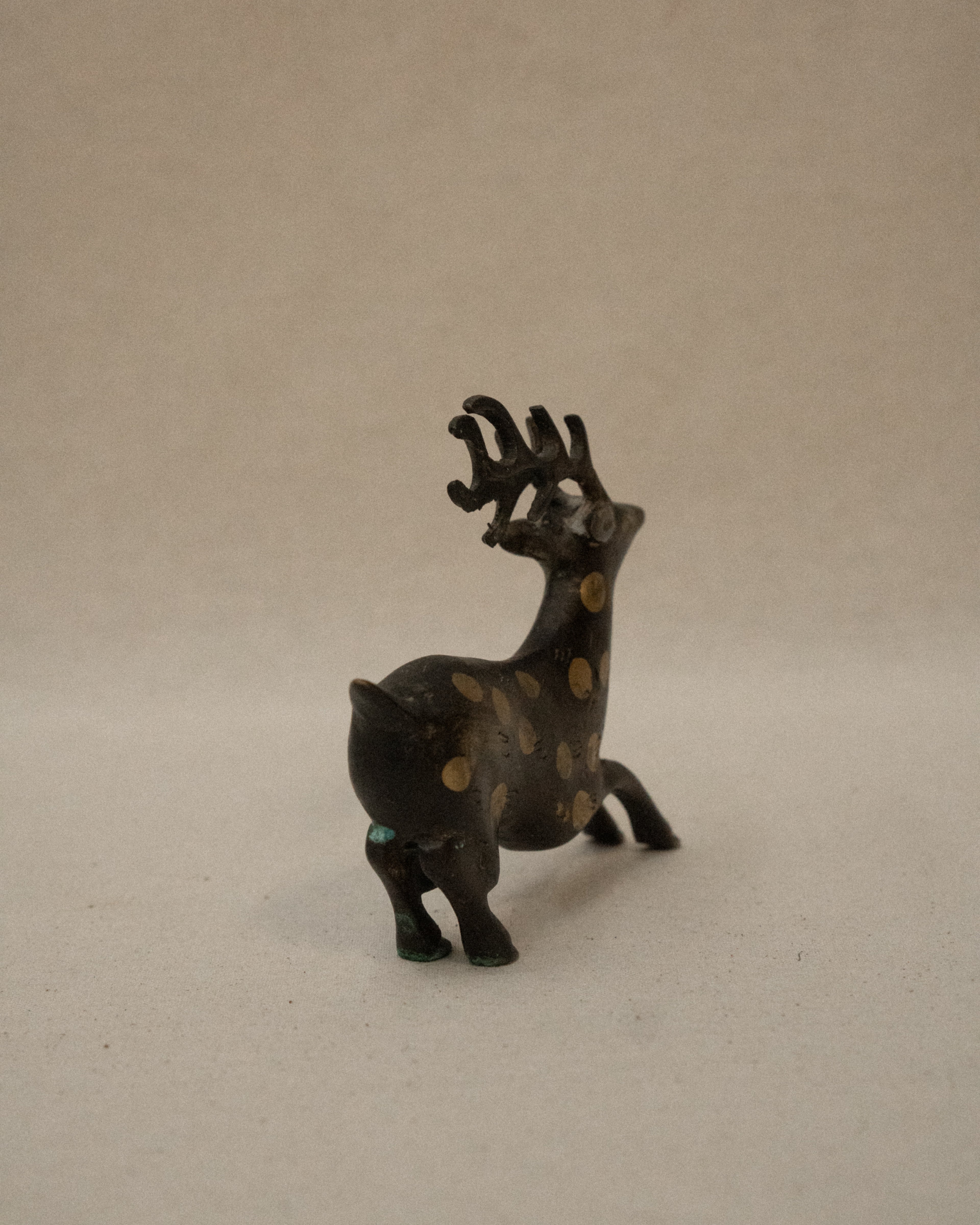 Solid spotted brass deer