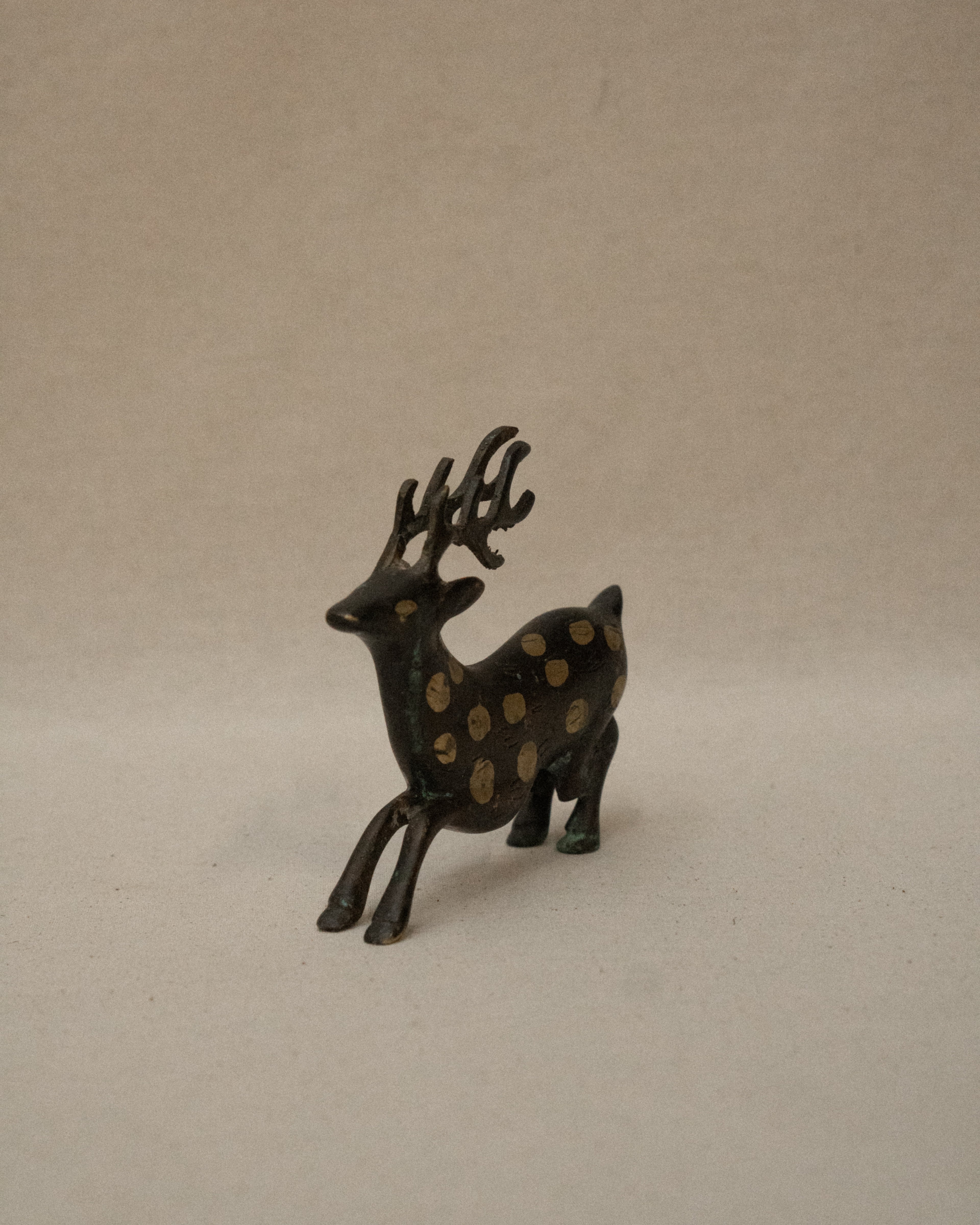 Solid spotted brass deer