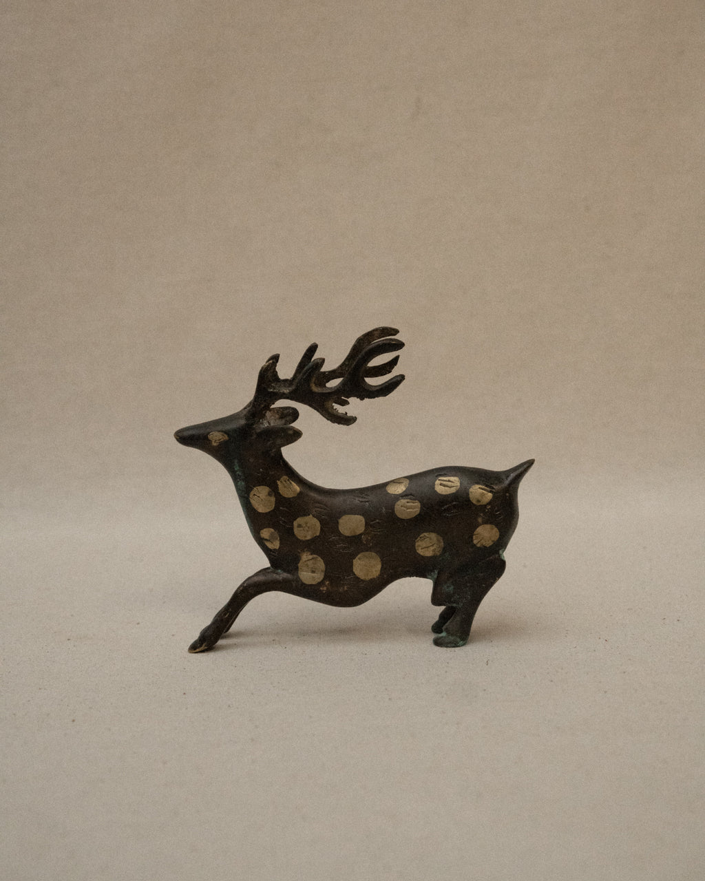 Solid spotted brass deer