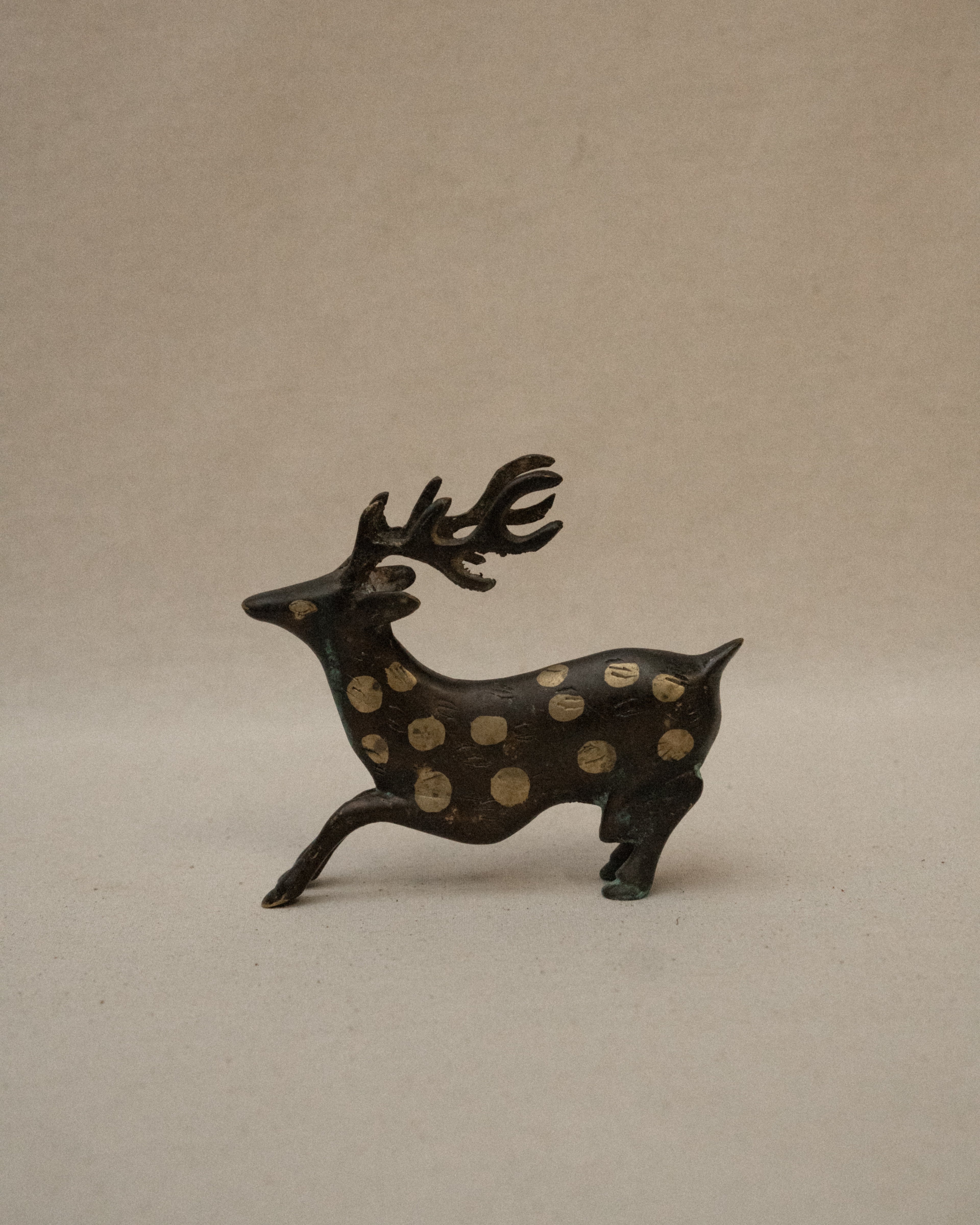 Solid spotted brass deer