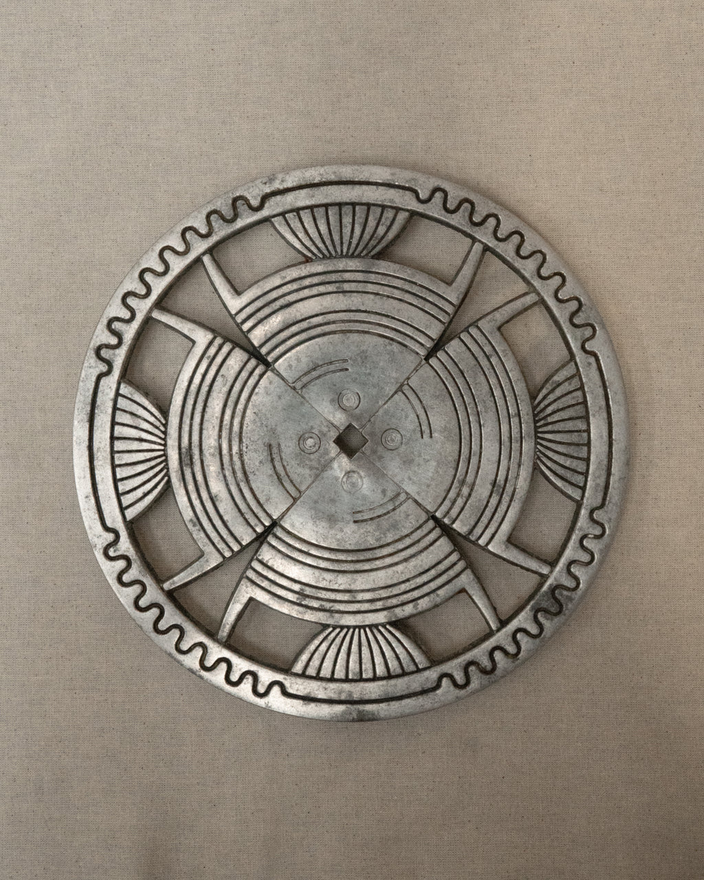 Aluminum trivet with interesting details