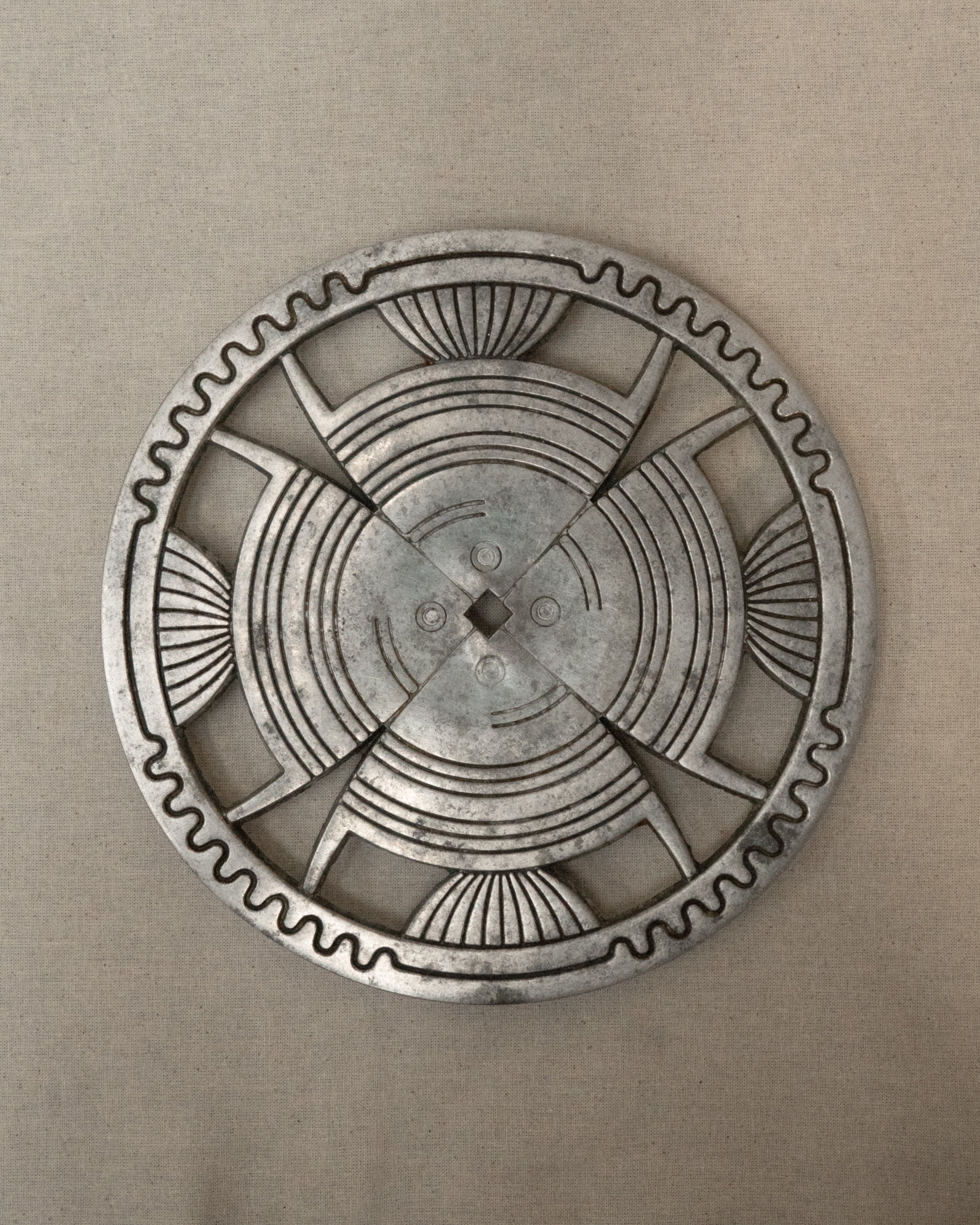 Aluminum trivet with interesting details
