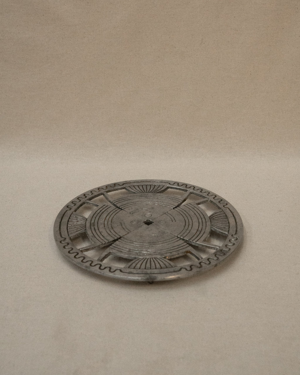Aluminum trivet with interesting details