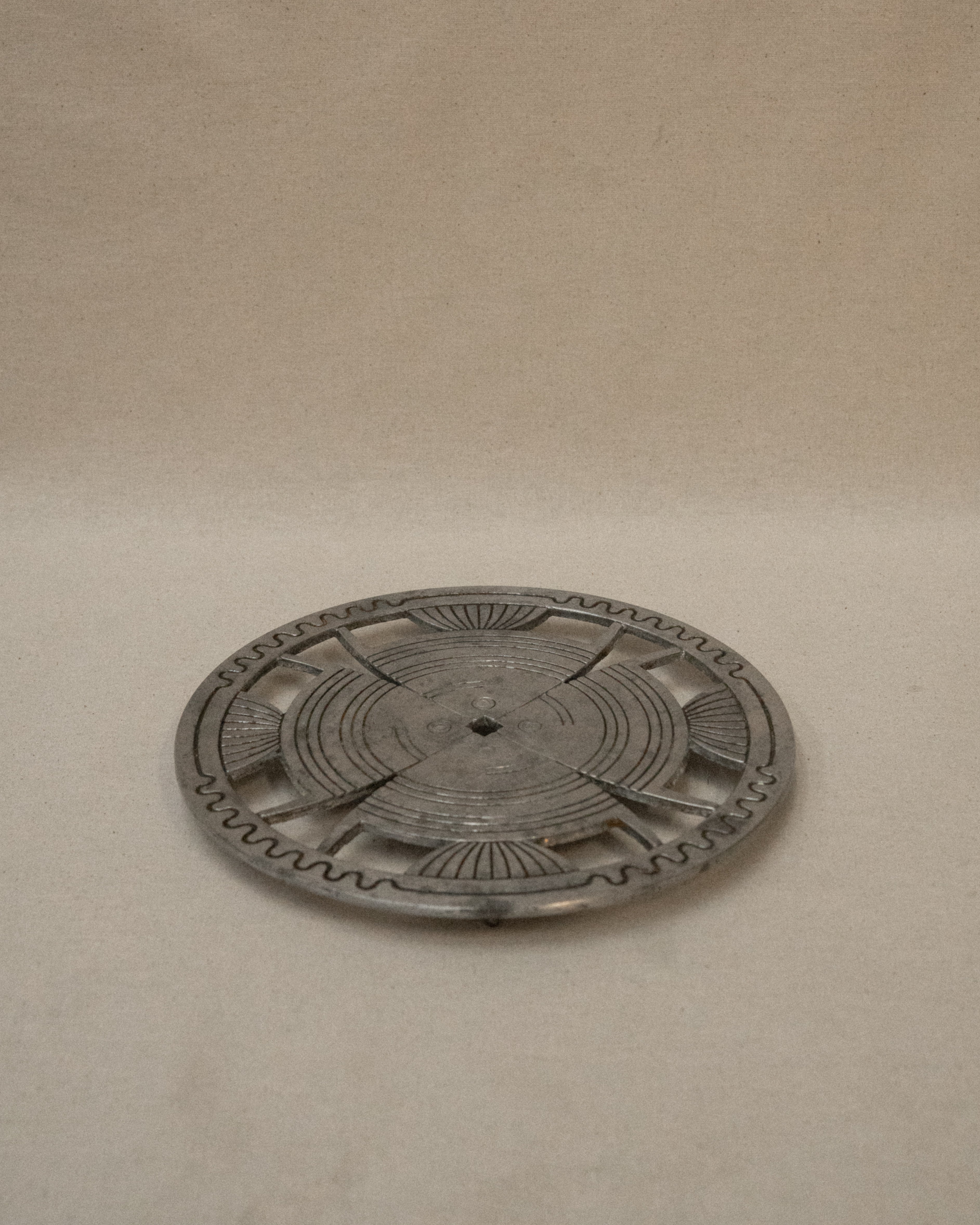 Aluminum trivet with interesting details