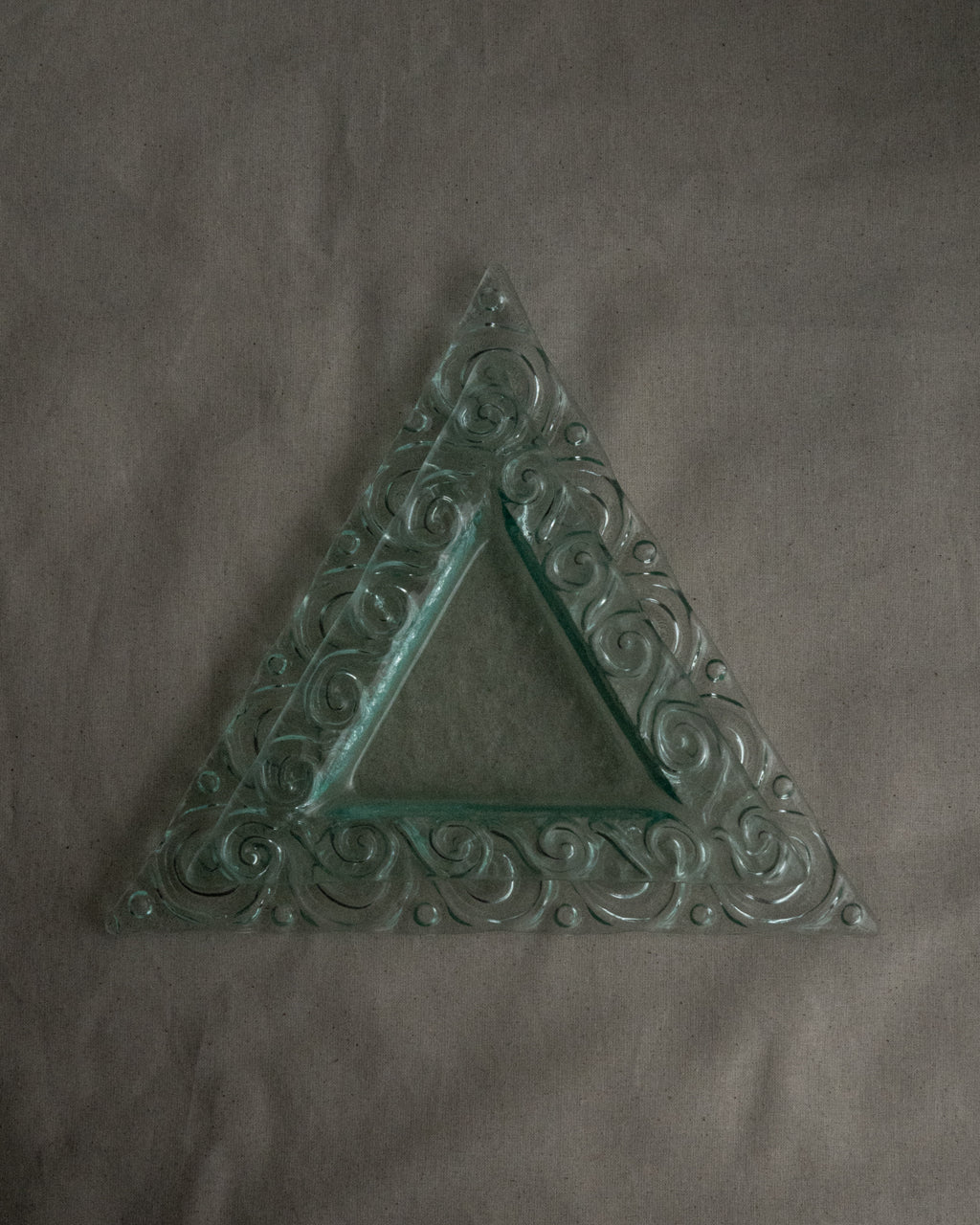 Pair of stackable triangle glass trays with spiral edges