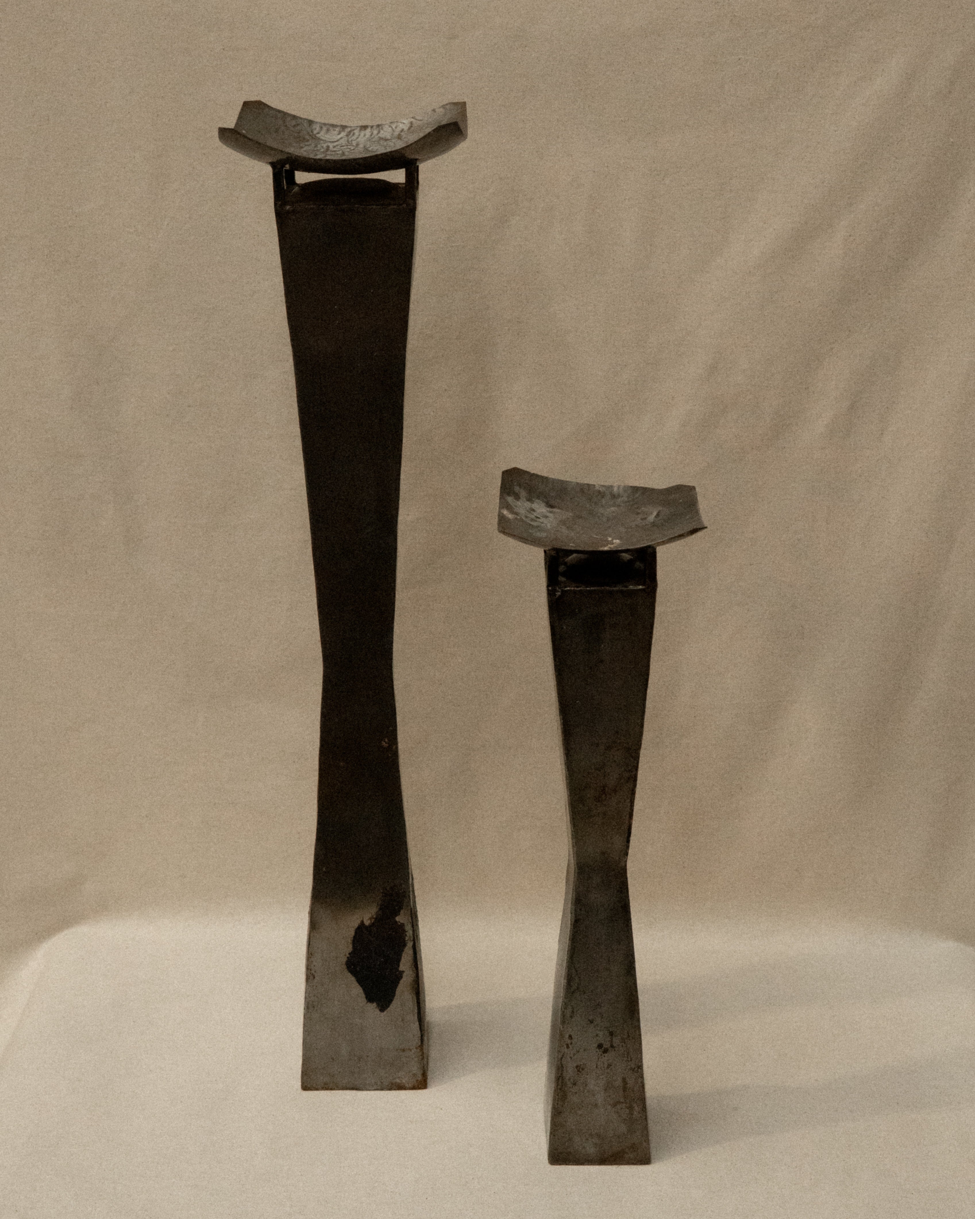 Pair of brutalist metal candle holder pedestals