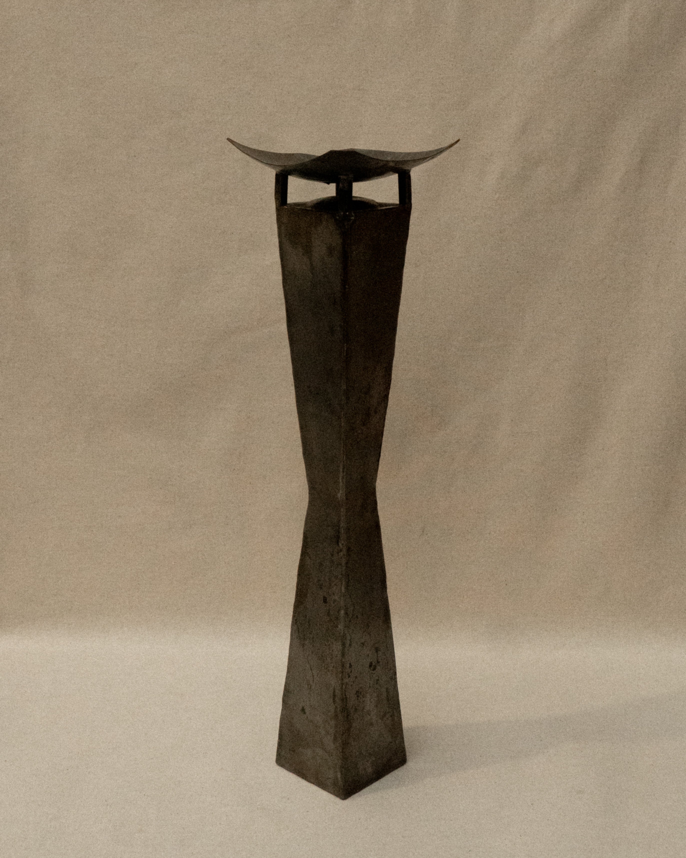 Pair of brutalist metal candle holder pedestals