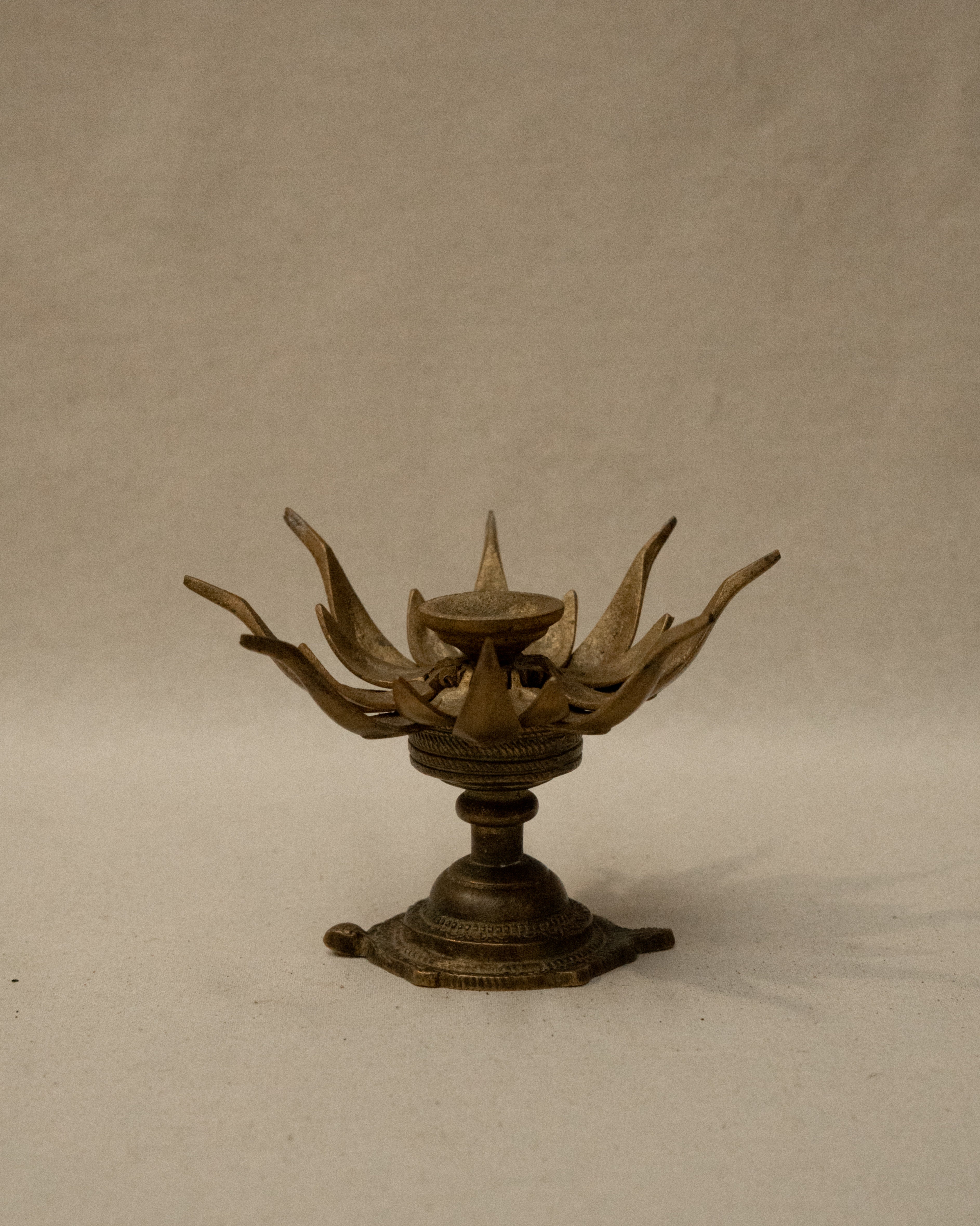 Brass lotus flower on tortoise incense/candle holder